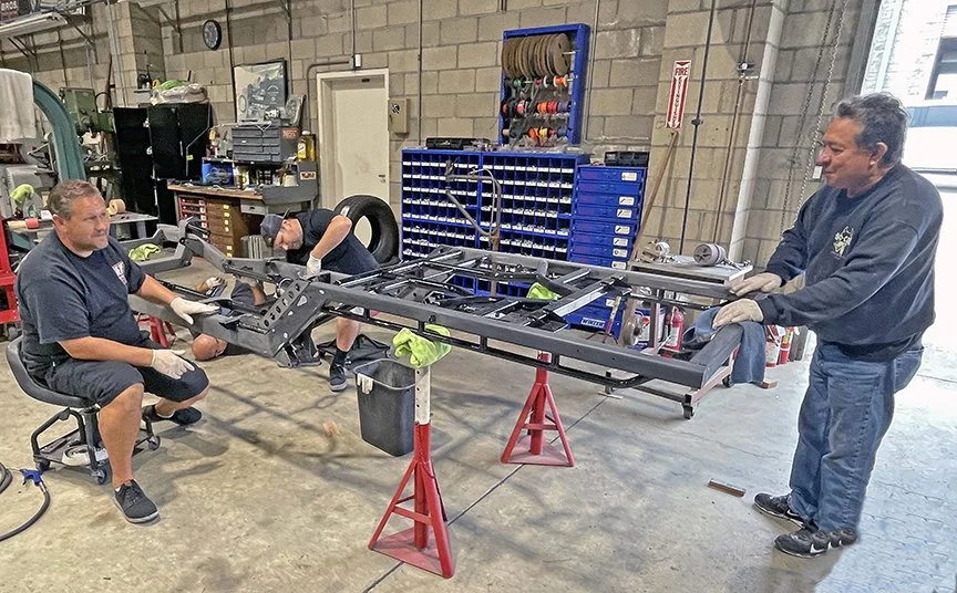 Evin, Justin, and Serafin rub out the frame