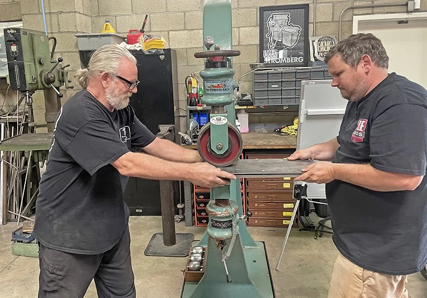 Kev Elliott and Justin press in the tailgate logo