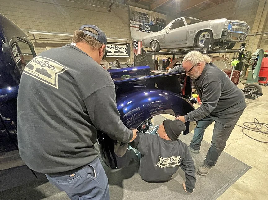 Evin, Justin, and Kev Elliott install the rear fenders