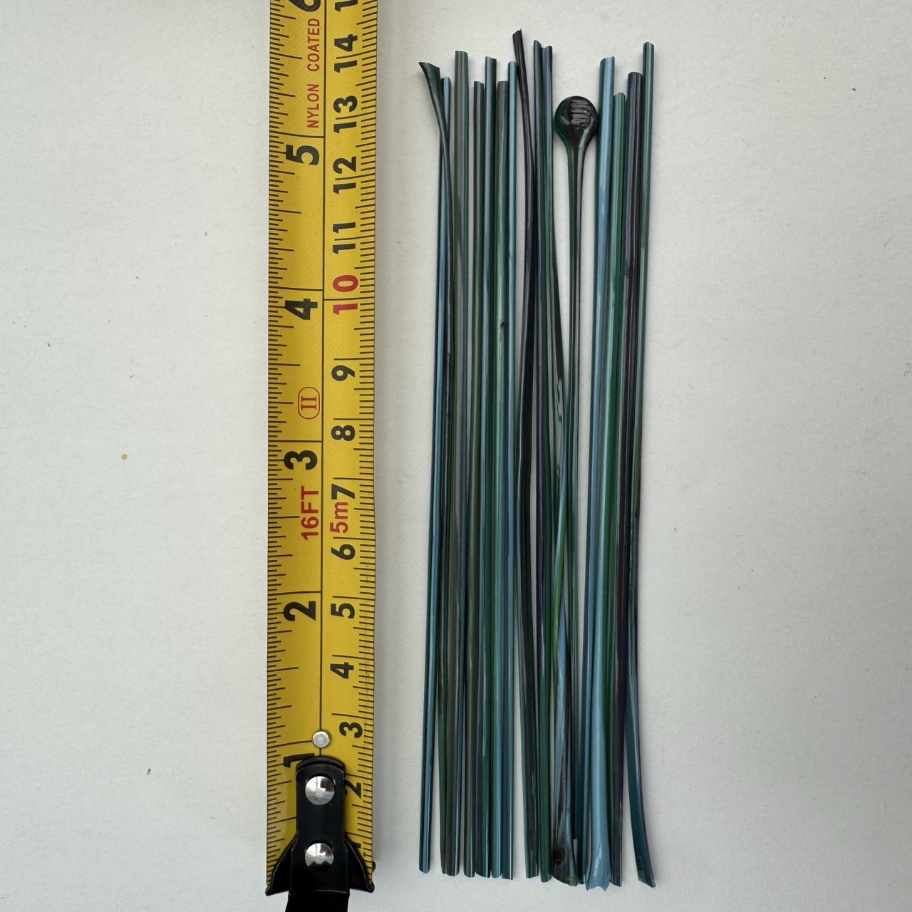 Teal filati with tape measure.jpeg