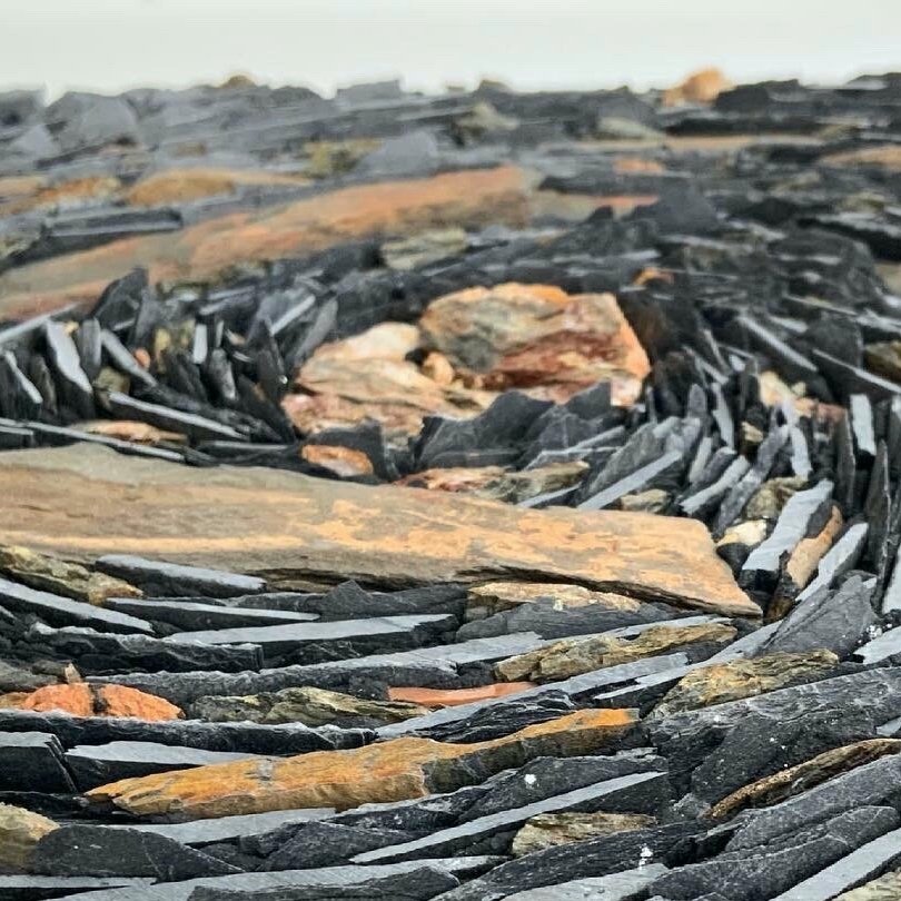 Detail shot of the mosaic Star Trails 2. Made with slate, stone and glass by Rachel Davies Mosaic Artist and Online Educator