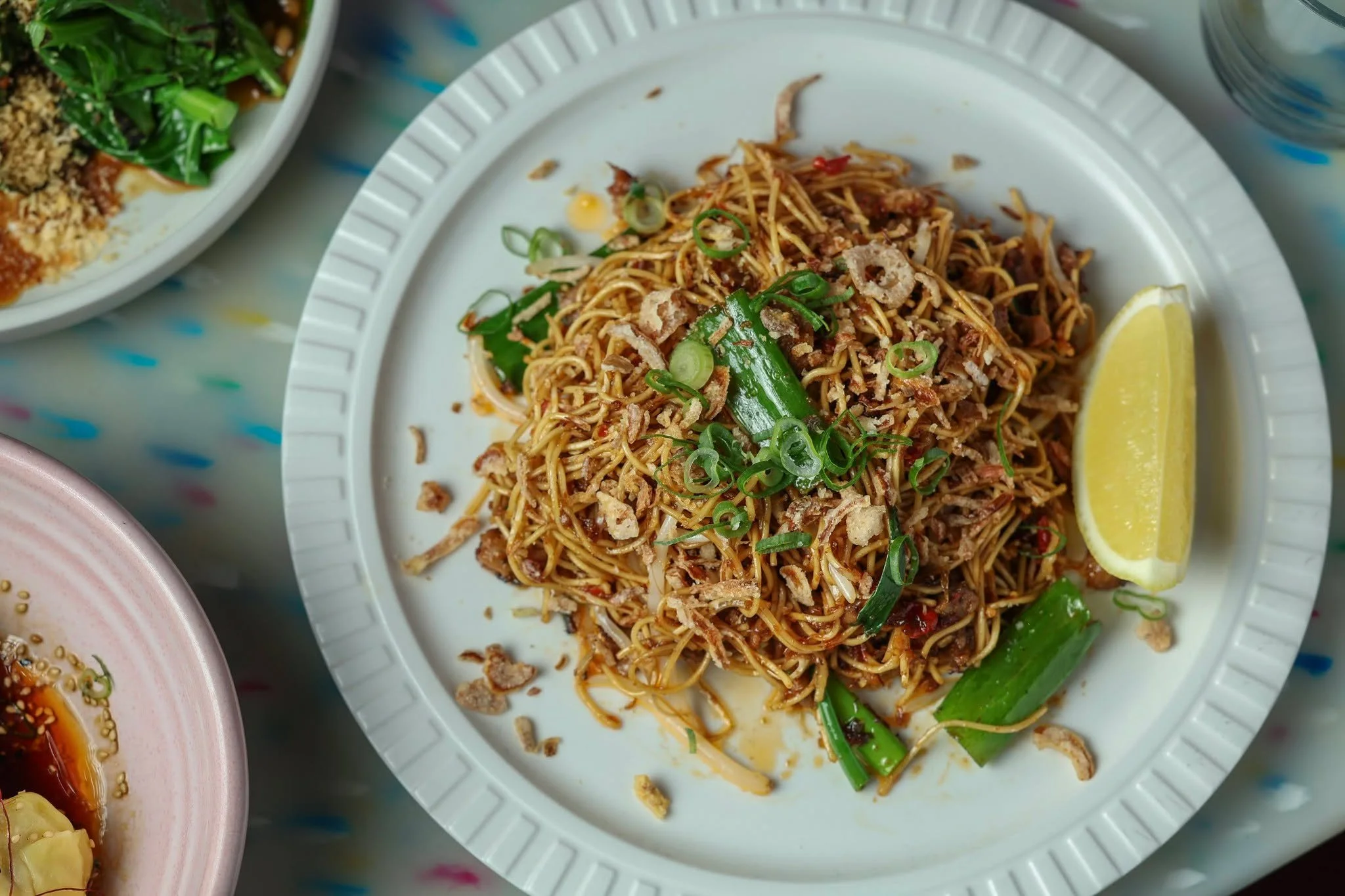 Tossed in savoury aromatics, crisp scallions, and a squeeze of fresh lemon for the ultimate balance of flavor and crunch. Every bite brings together bold notes and delicate textures for a truly unforgettable start to your evening. 

Reserve your spot