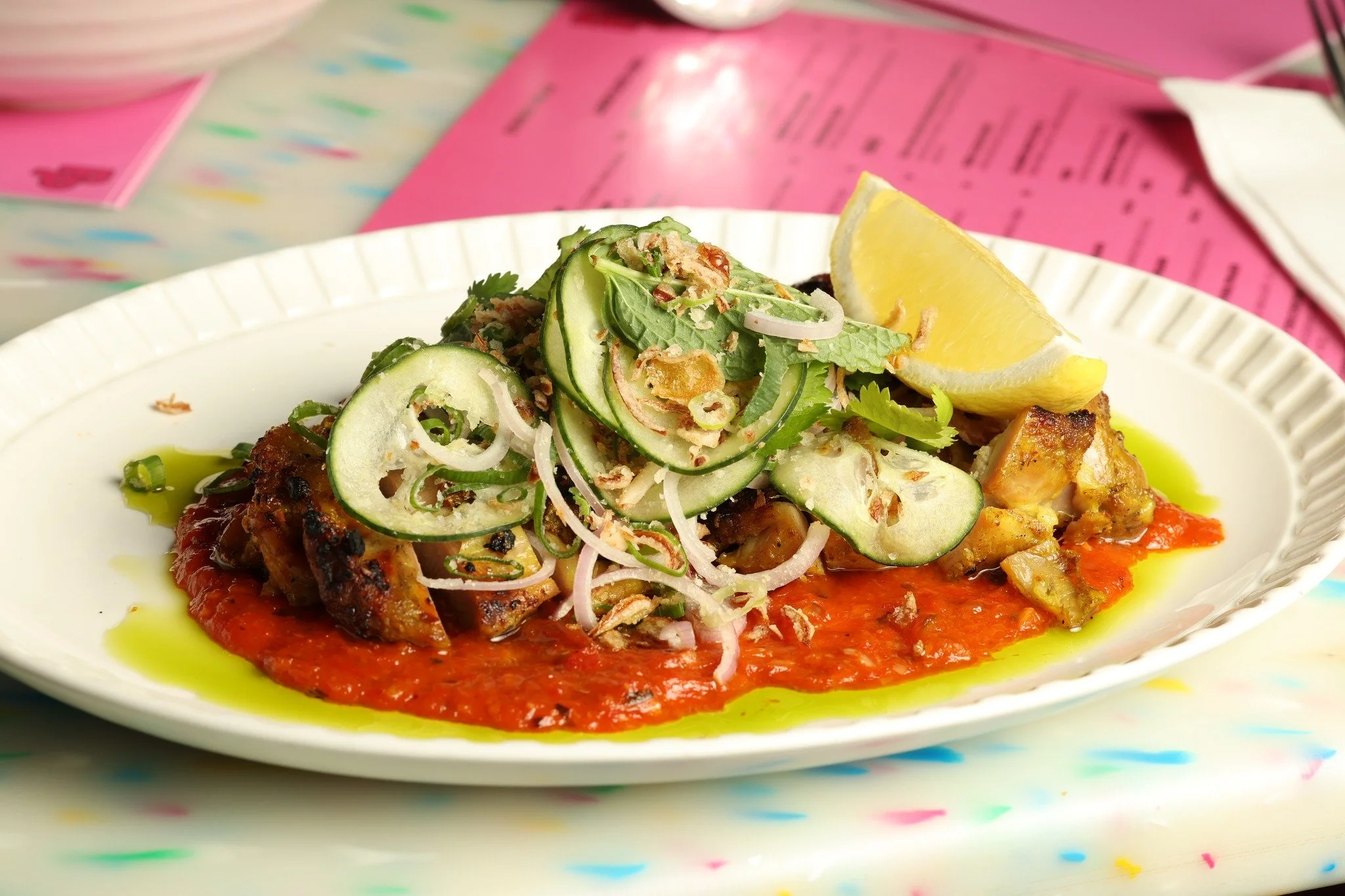 Grilled chicken drizzled with a vibrant, zesty red sauce and fresh cucumber garnish.

Reserve your spot:
https://www.sevenrooms.com/explore/pingpong/reservations/create/search

#pingpong #grilledchicken #foodie #delicious