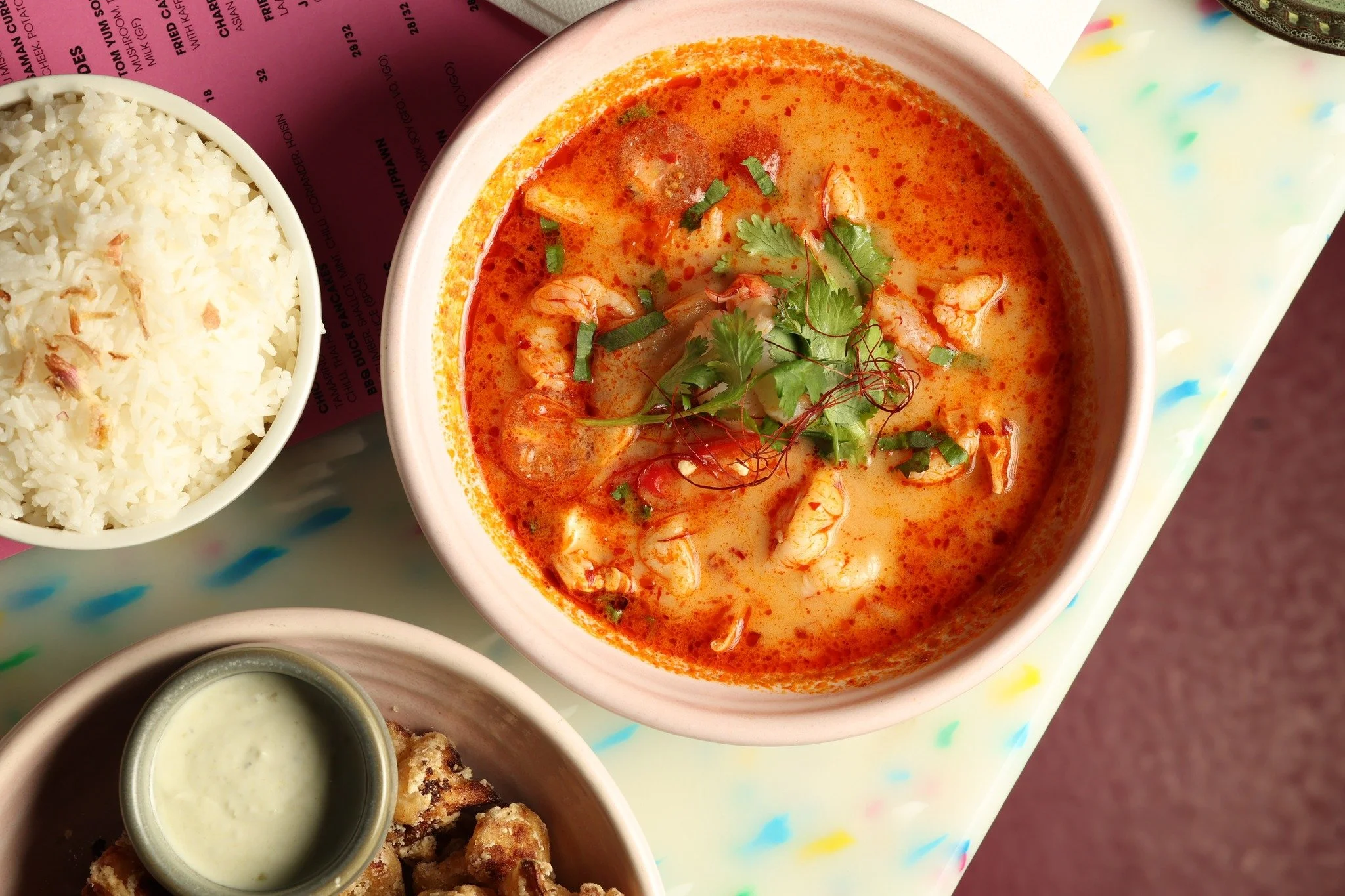 Rich and spicy tom yum soup served with fragrant steamed rice and a side of crispy bites.

Reserve your spot:https://www.sevenrooms.com/explore/pingpong/reservations/create/search

#pingpong #tomyum #thaifood #soup #foodie