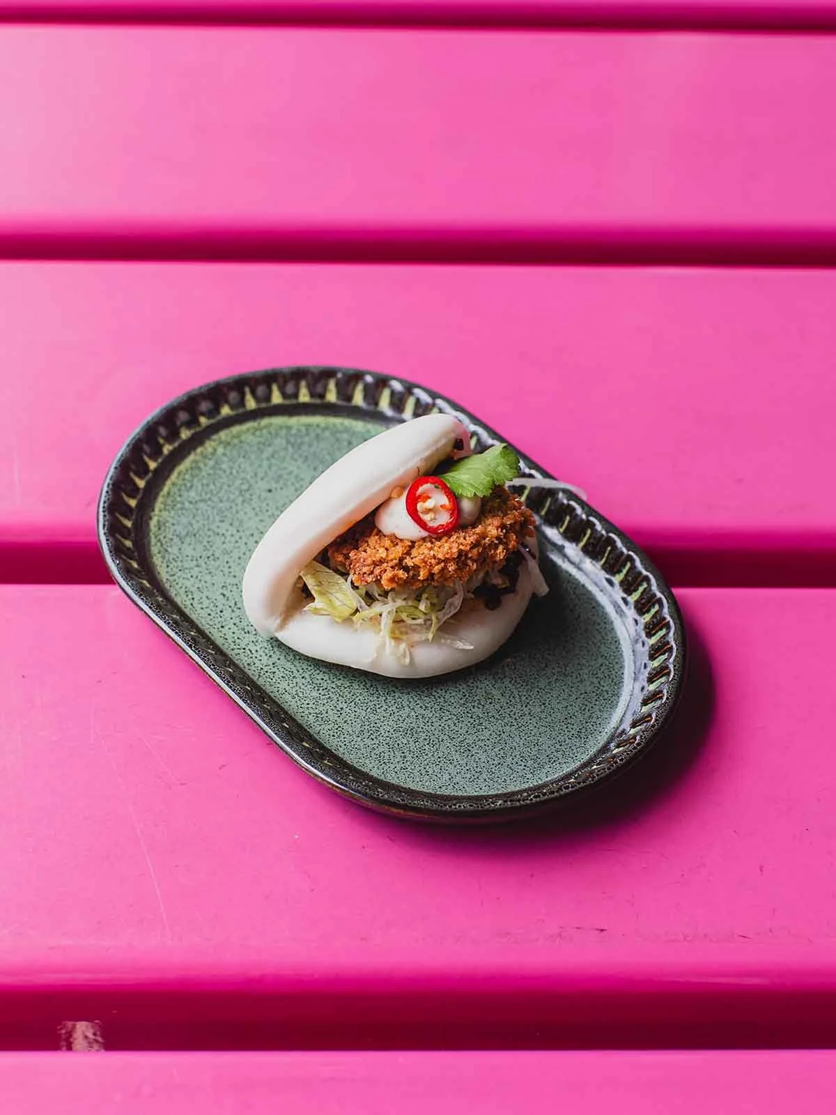 Pillowsoft, crispy, and packed with bold flavor. Meet your new obsession: golden crispy mushroom nestled in a warm, fluffy bao bun, topped with fresh slaw, fresh herbs, and a kick of chili. 

Taste perfection today reserve your table now via the link