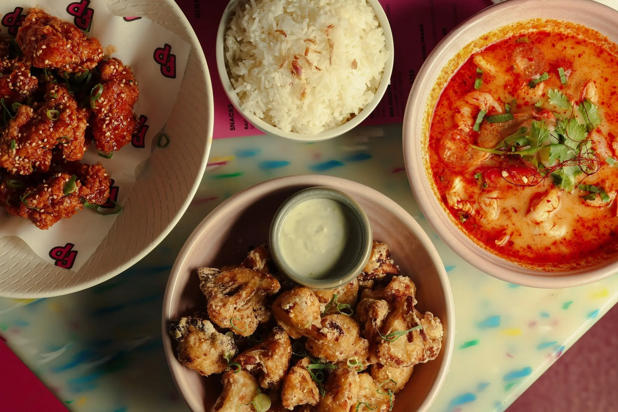 Sticky glazed fried chicken, crispy cauliflower bites, fragrant jasmine rice, and rich coconut red curry soup. Bring friends, order everything, and split the feast.

Book your feast right now: https://www.sevenrooms.com/.../reservations/create/search