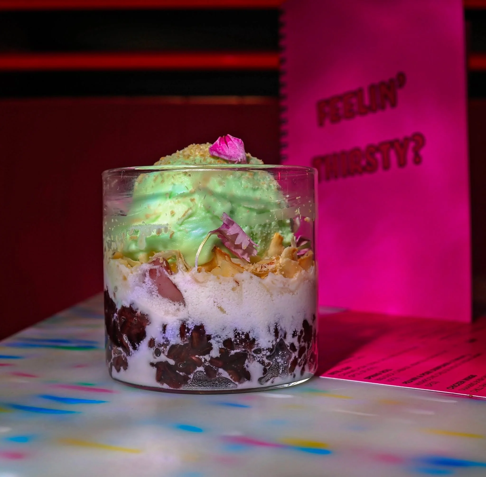 Layered decadence in every single spoonful. Warm black sticky rice folded with velvety coconut cream, topped with cool pandan ice cream, toasted coconut flakes, and edible florals. The sweet ending your table deserves. 

Book your table here: https:/