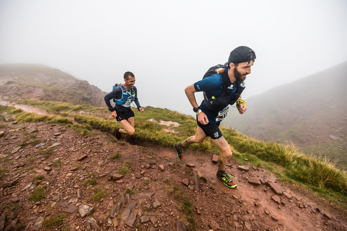 Simon and Russell running together through the Brecon Beacons ©No Limits Photography