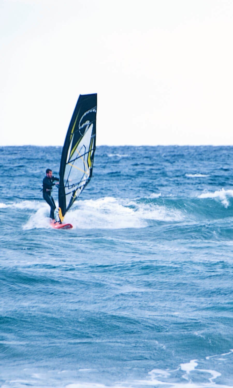 Lonely windsurfer Los Genovese