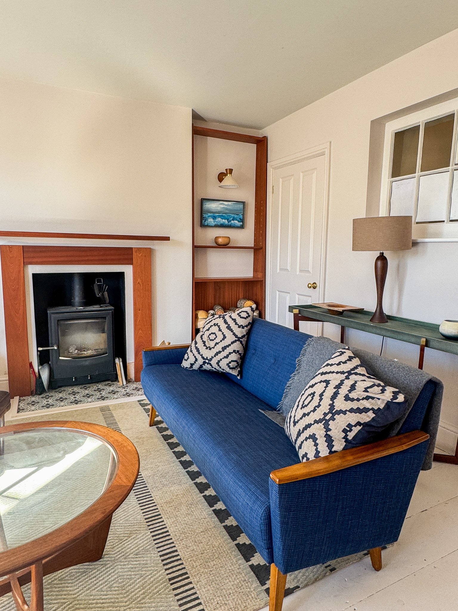 Colourful Victorian living room with mid-century modern furniture and artwork