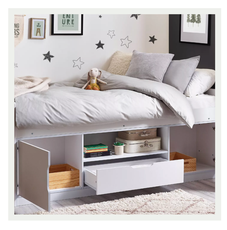 Timeless wooden bed in a stylish child's bedroom designed to grow with the child.
