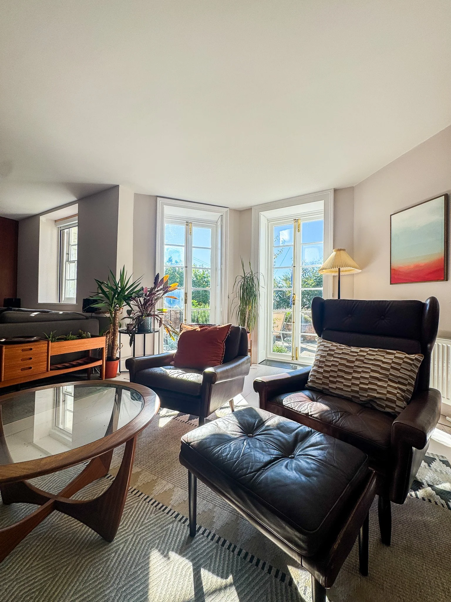 Victorian townhouse living room combining vintage and new furniture with mid-century style
