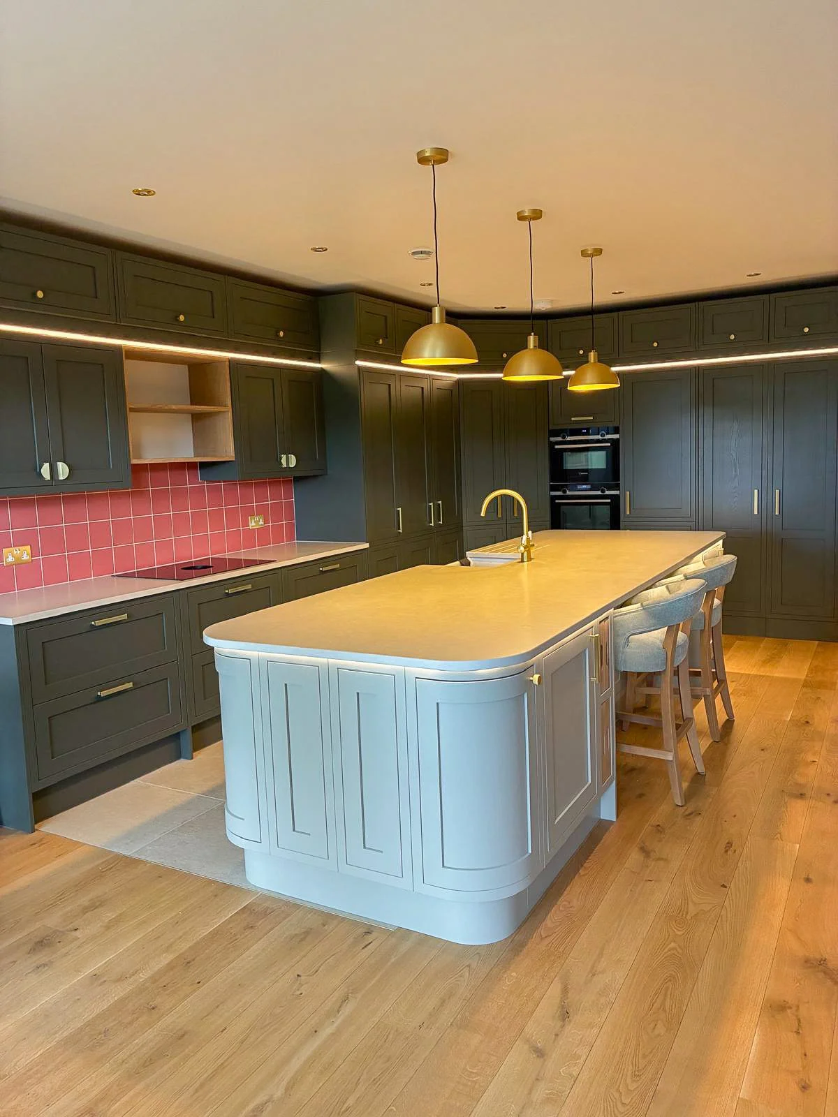 Bath period townhouse kitchen with large island, contemporary cabinetry and pendant lighting