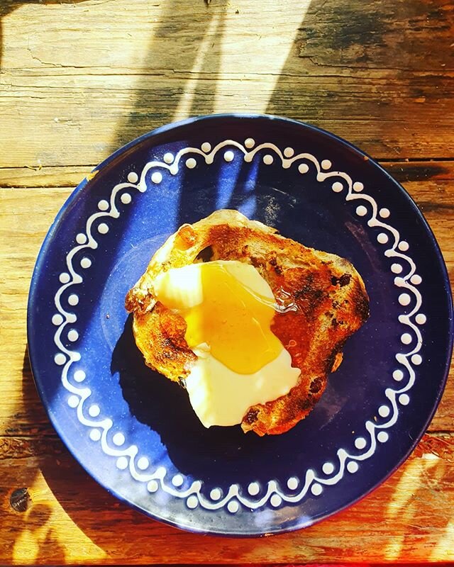 The last spiced bun, toasted, with a slab of Britanny salted butter and the most divine Cretan Raw Thyme Honey by @thehellenicdeli. Sun on a plate! Have a good week!