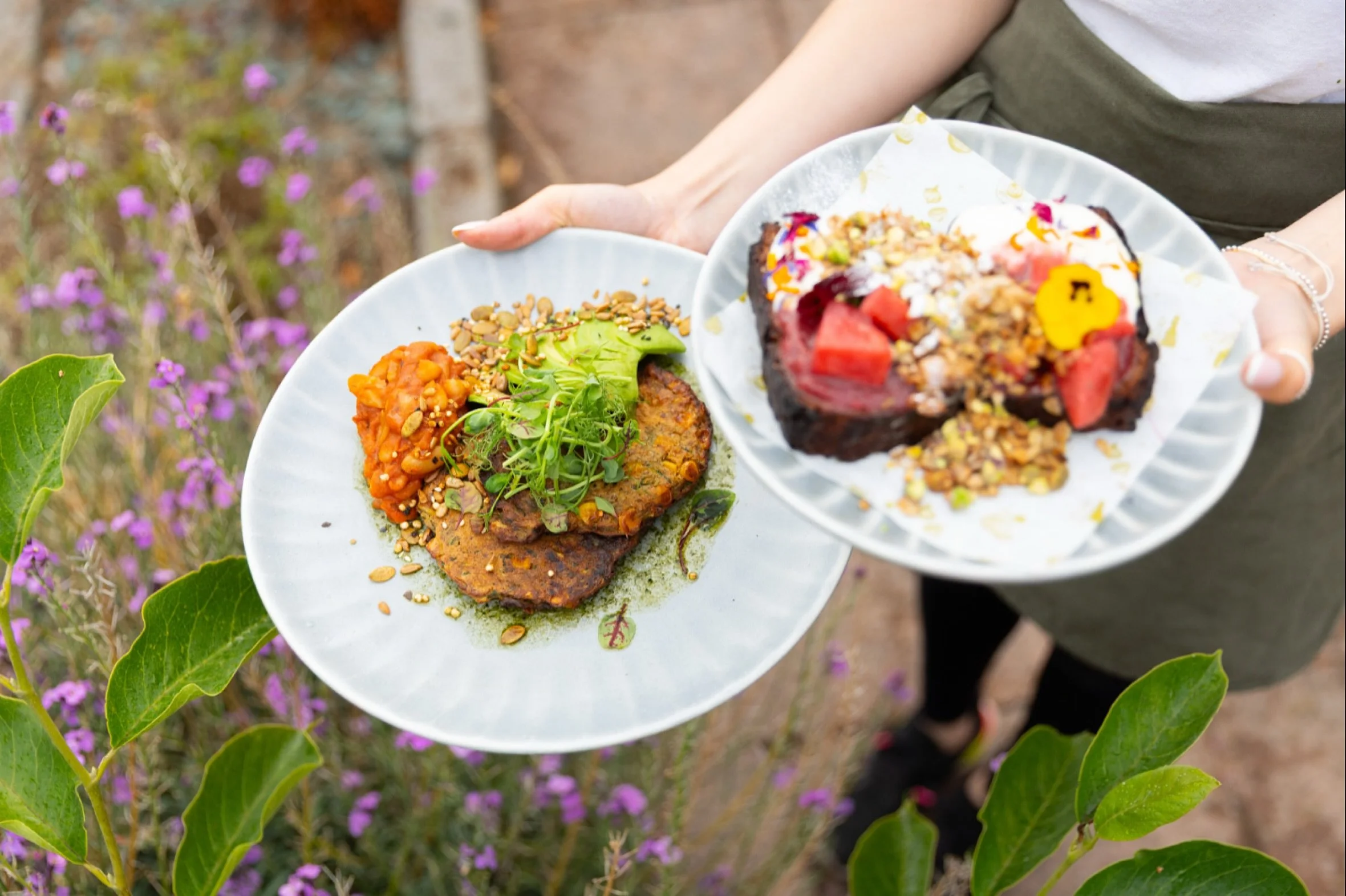 Tuck into our golden Sweetcorn Fritters with creamy avocado, smoky beans and crunchy seed granola 🌿🌞. 
Or indulge your sweet side with our much-loved Maple Banana Bread, crowned with yoghurt, jam, fresh berries, pistachios and petals 🍓🍌🌸