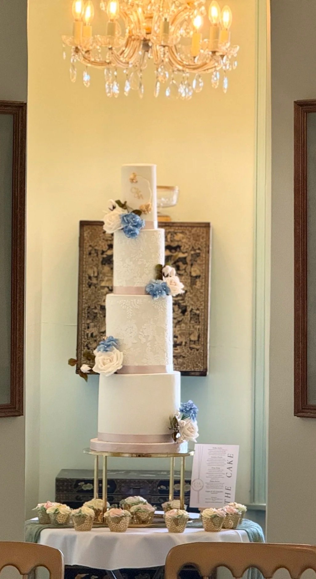 4 tier white and pastel coloured wedding cake at Wadhurst Castle