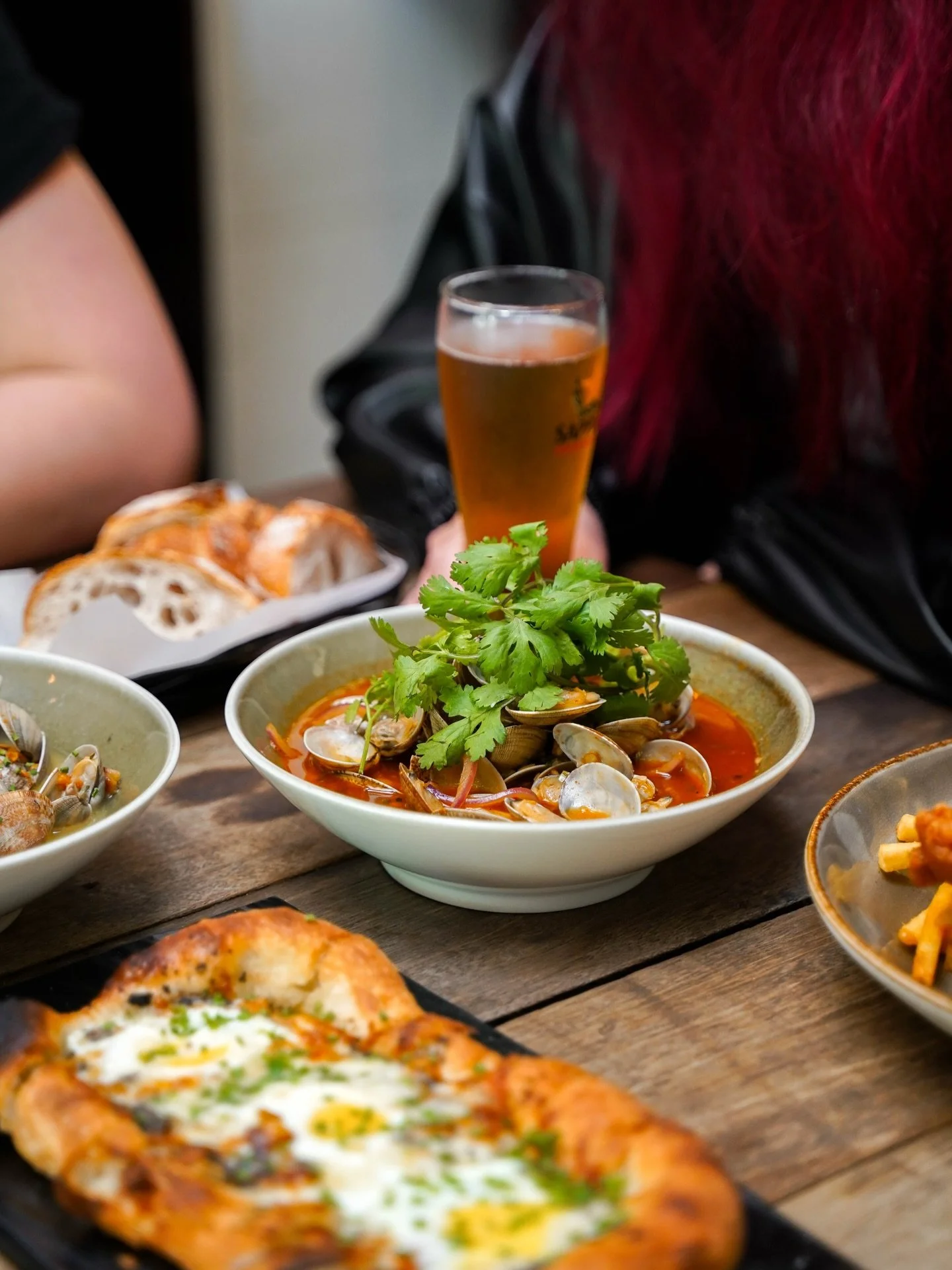 Something spicy and comforting - lala clams in a sriracha white wine sauce, served with fresh baguette. 

Make a reservation at nassimhill.com.sg 🏡