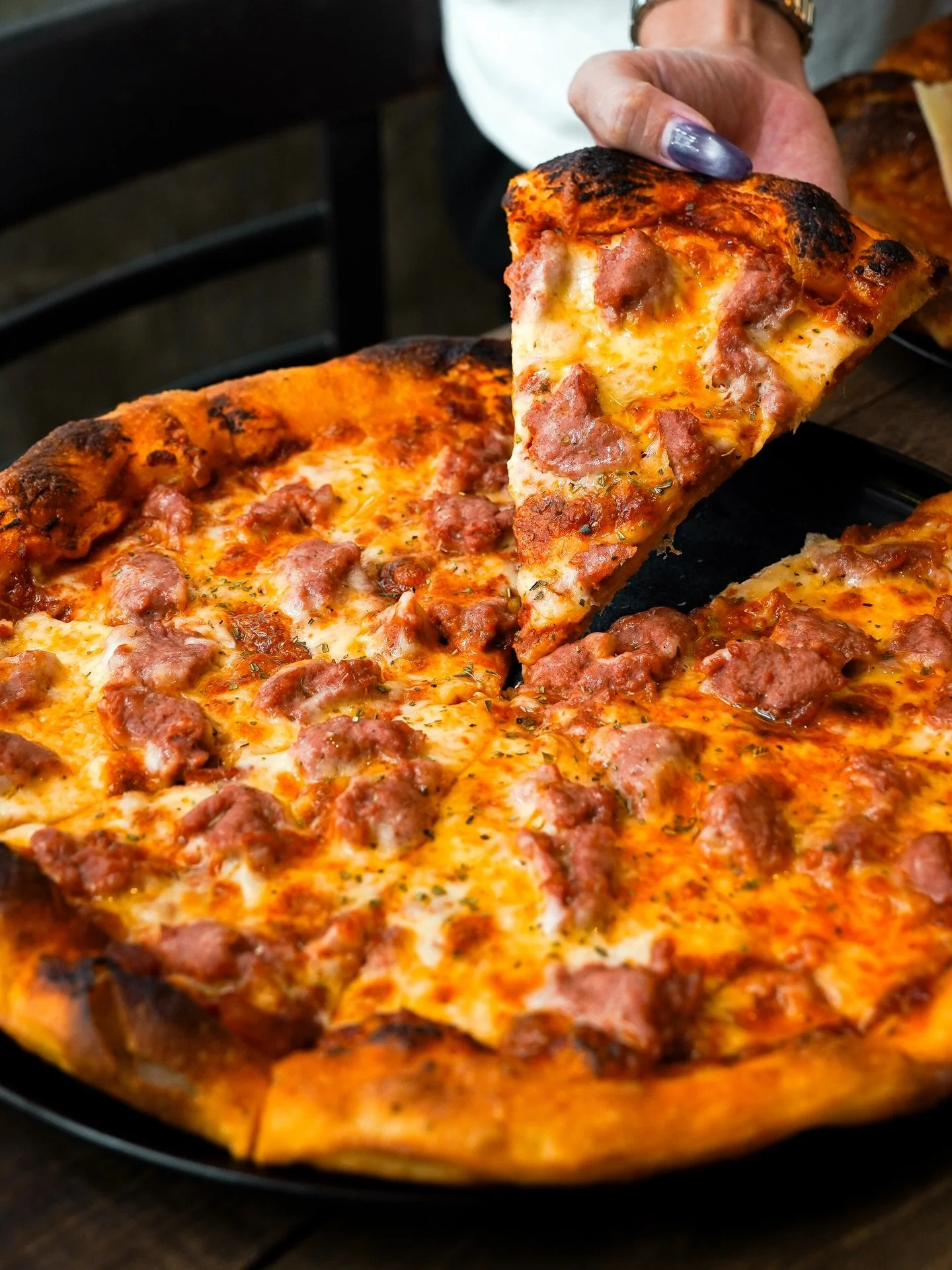 Smoky kransky sausage, melted cheese, and a crust that holds it all together nicely. 

No frills, no pretenses. 

Make a reservation at nassimhill.com.sg.