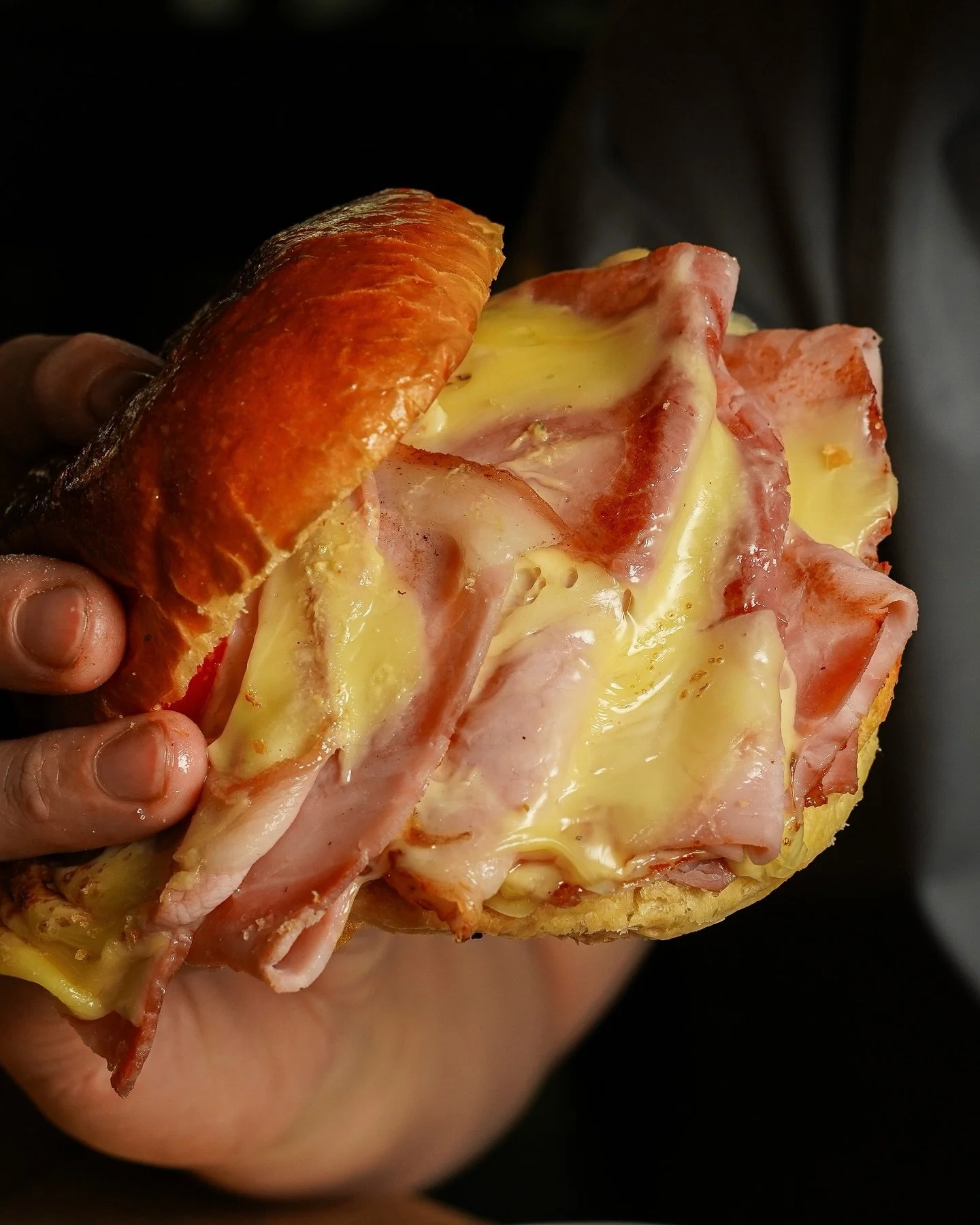 Messy, like a good burger should be - layers of ham, melted cheese, and caramelised onions tucked into a soft brioche bun.

Make a reservation &rarr; nassimhill.com.sg