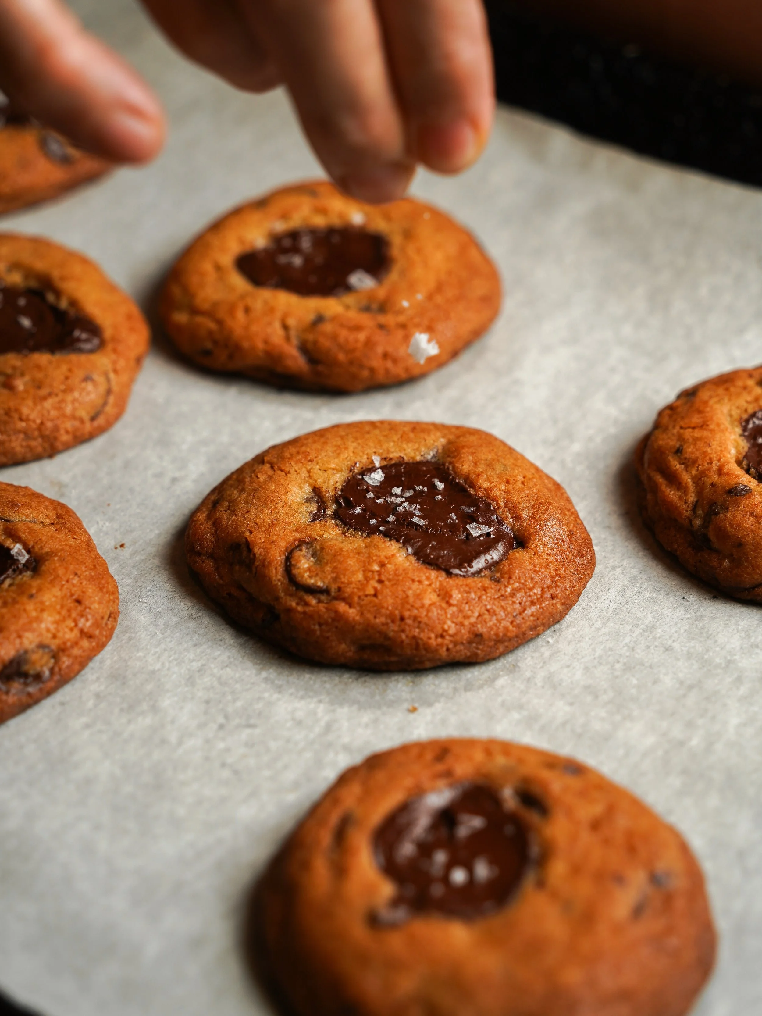 Warm chocolate chunk cookies, soft in the centre with bittersweet chocolate in every bite.

Finished with a touch of sea salt, just enough to bring everything into place.

Freshly baked daily.

Walk-in or get it delivered at nassimhill.com.sg.