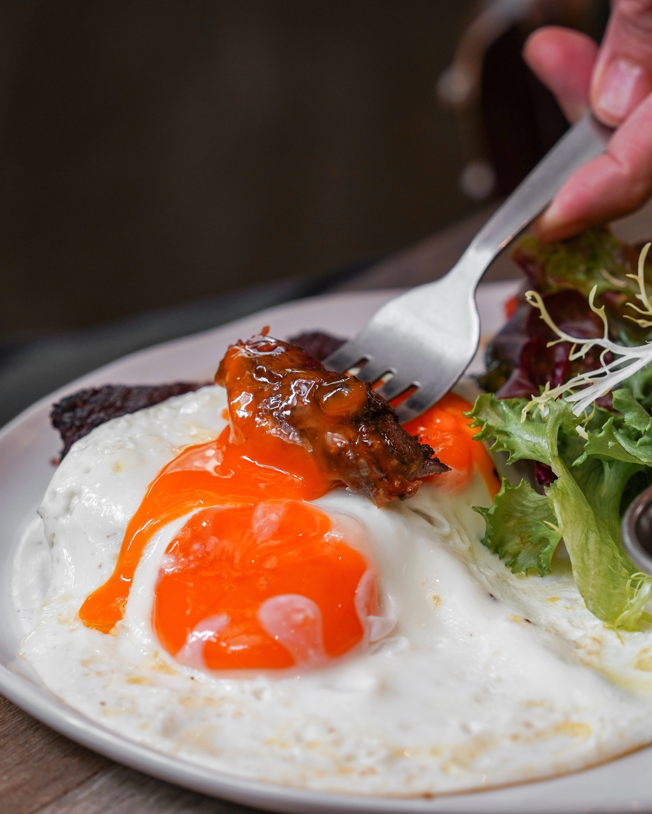 Best way to enjoy steak at brunch - dunk it into a runny egg yolk.

Make a reservation &rarr; nassimhill.com.sg