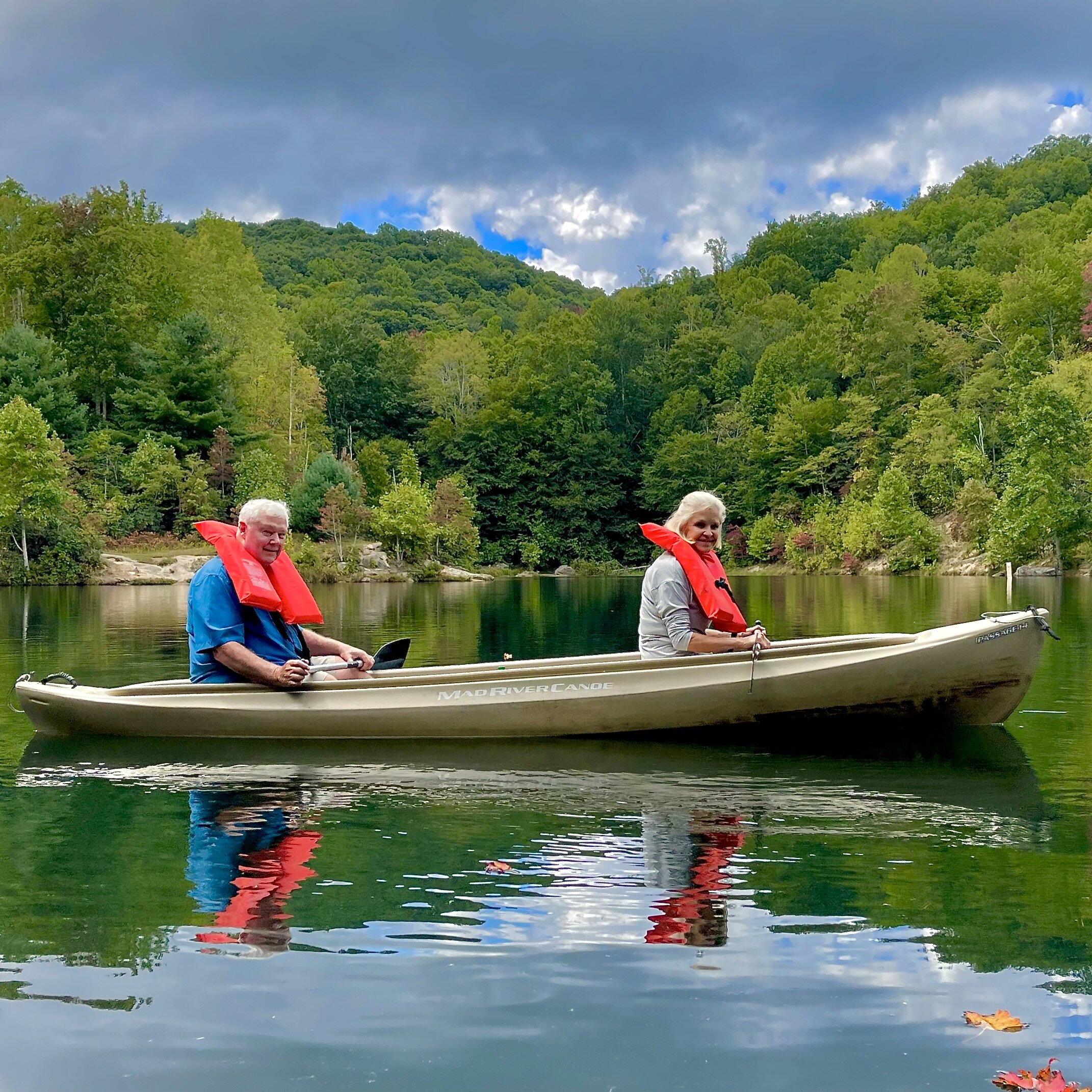 Couple canoeing on lake .jpeg