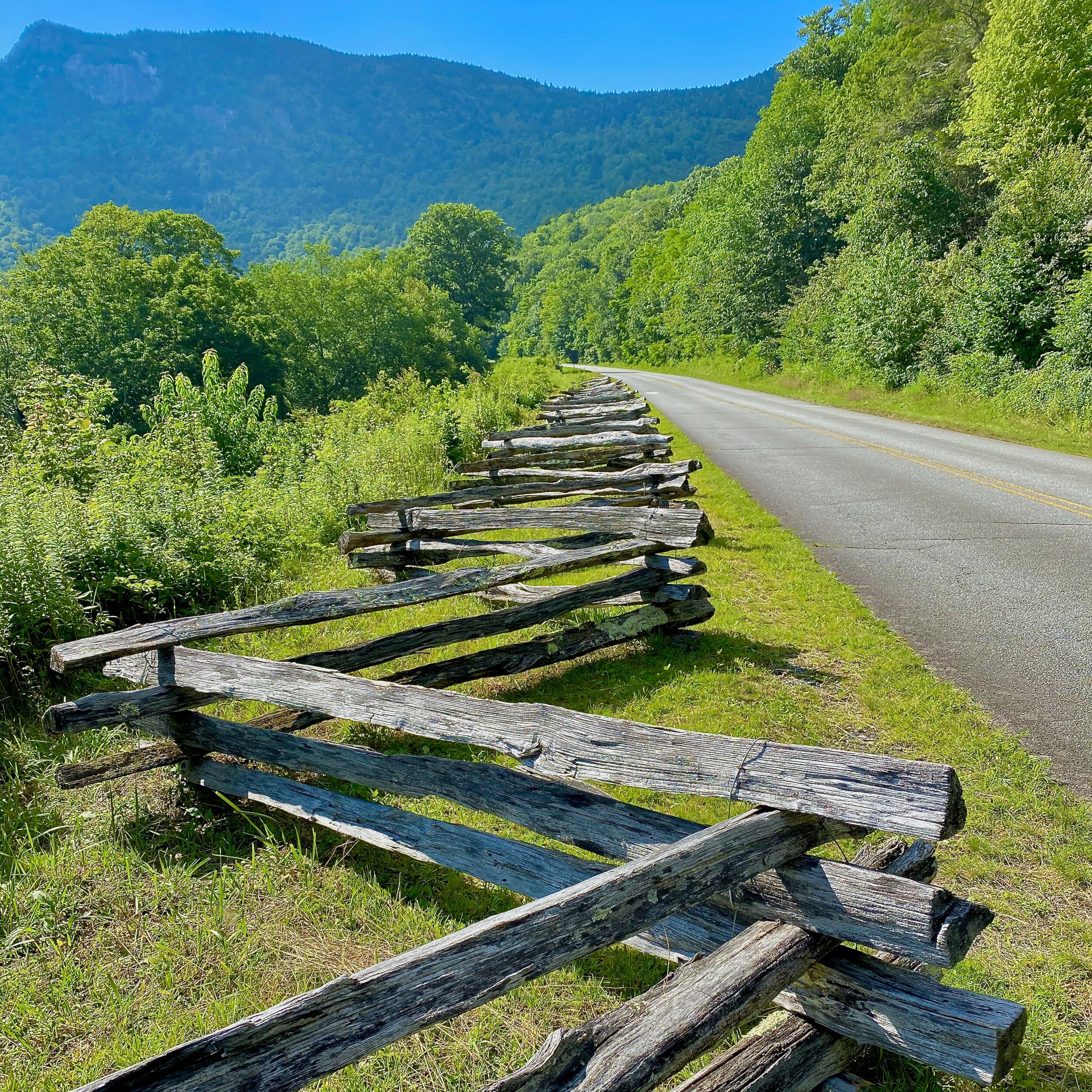 Open road with split rail fence.jpeg