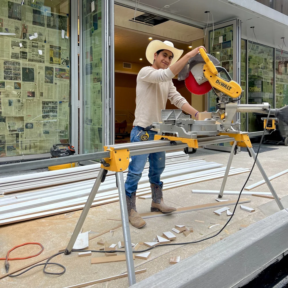 Young construction guy on sidewalk.jpeg