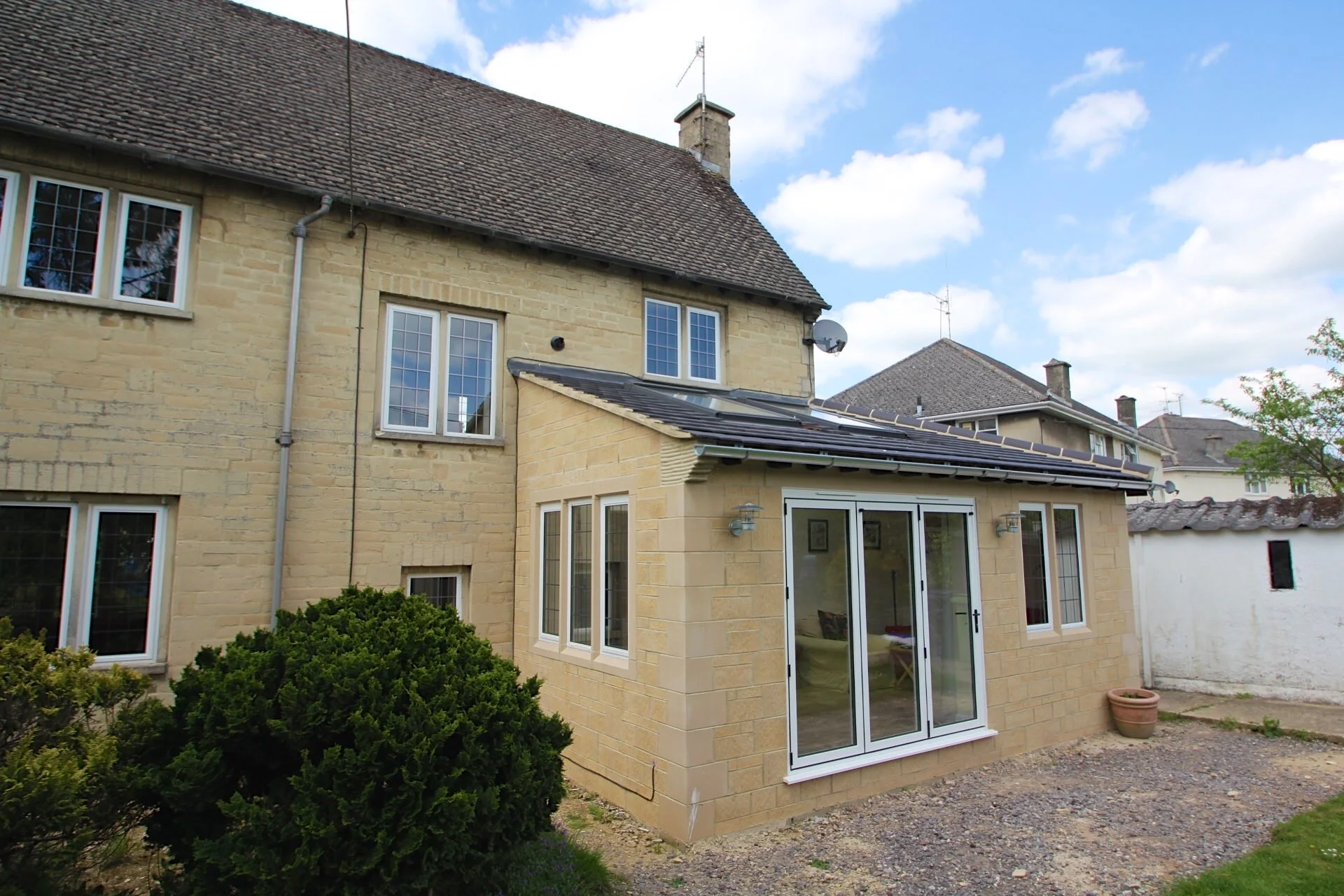 Wrap-around house extension design and planning