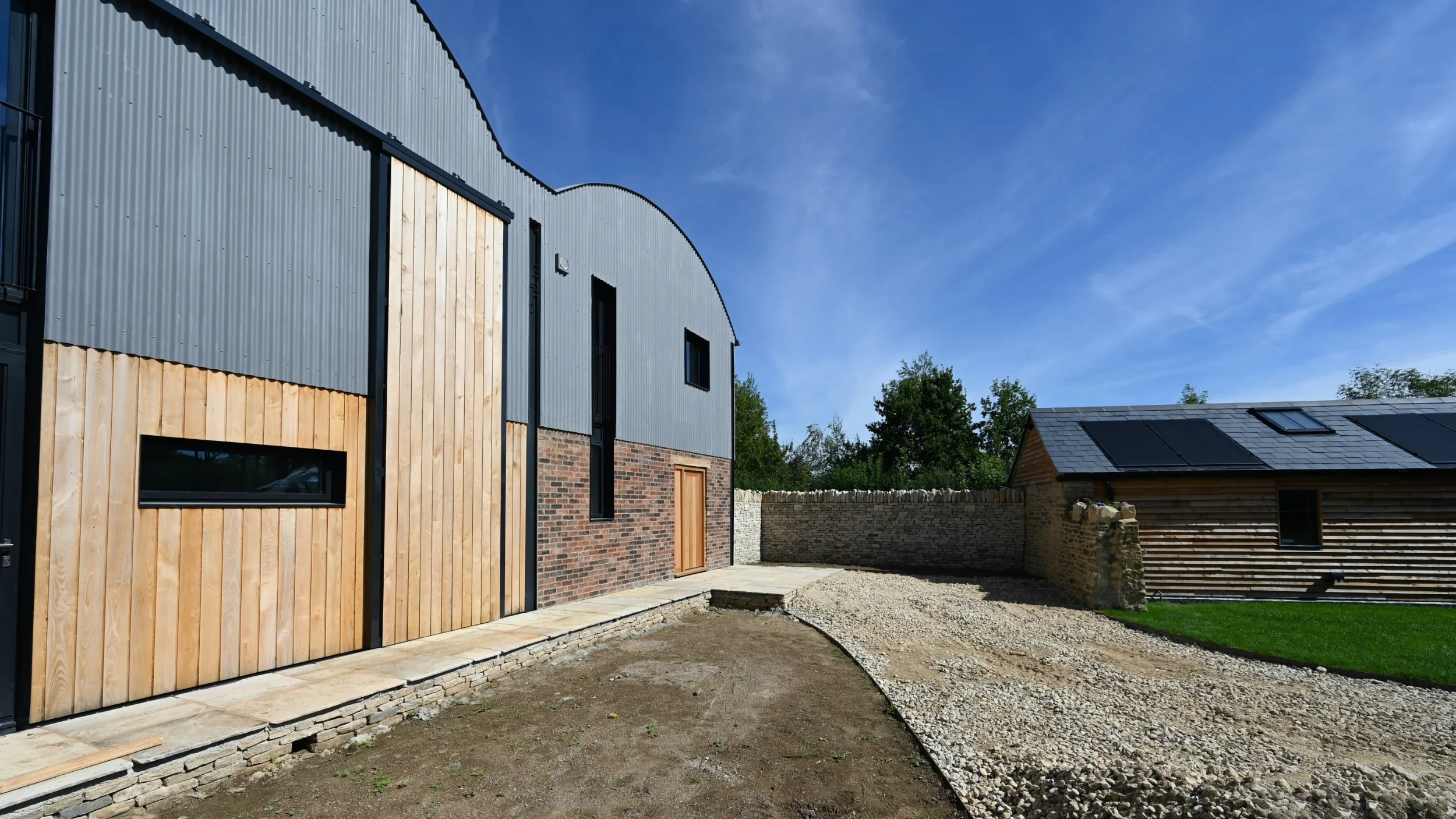 Dutch barn conversion and new build