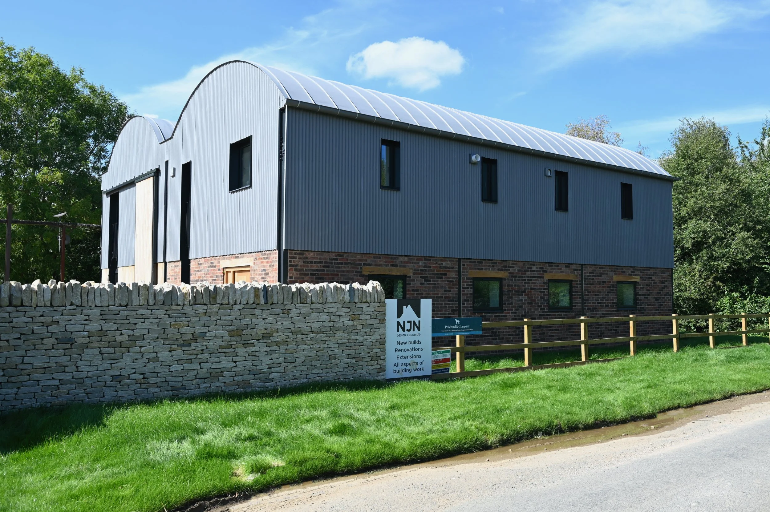 Dutch barn conversion and new build