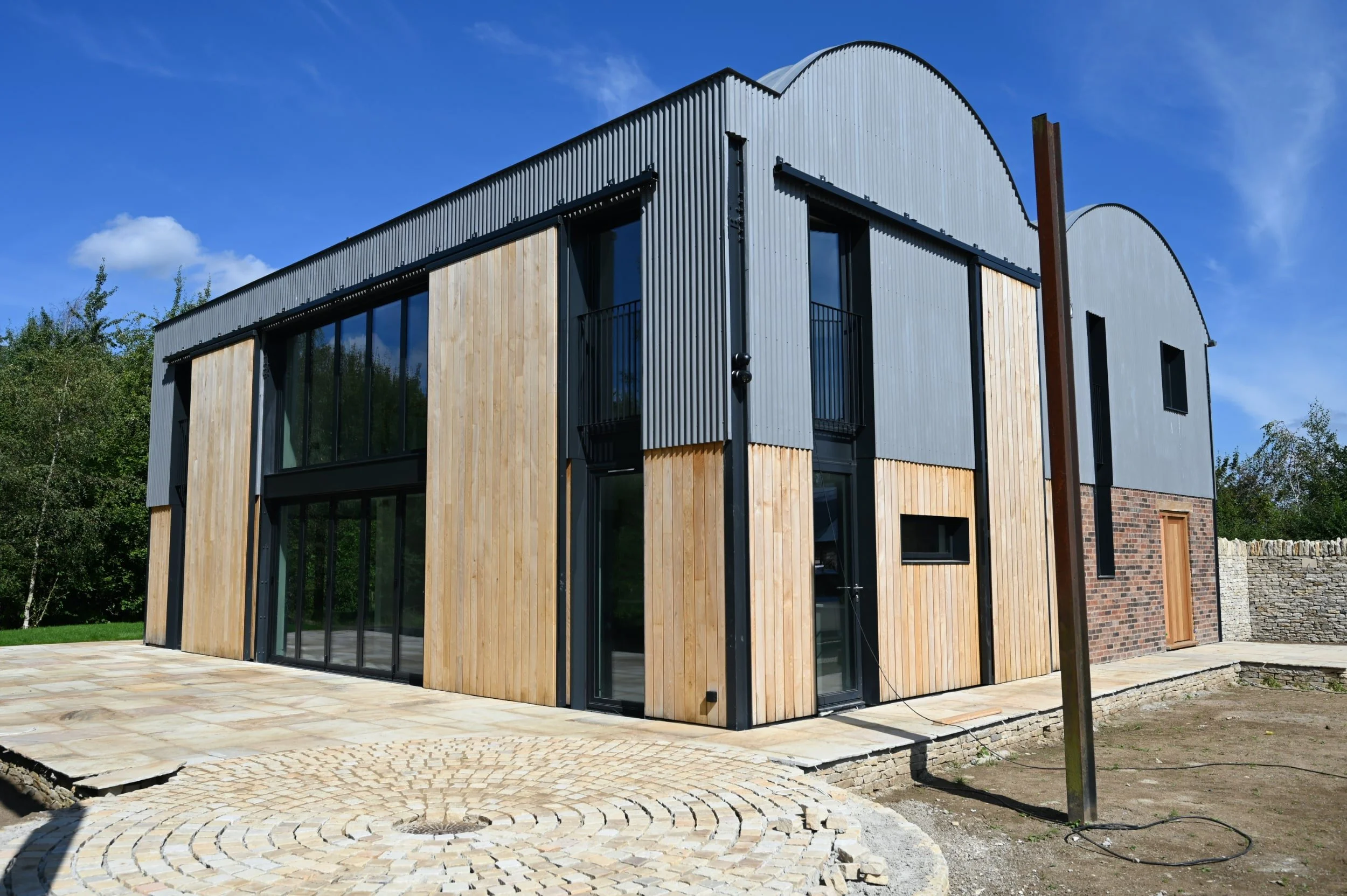 Dutch barn conversion and new build