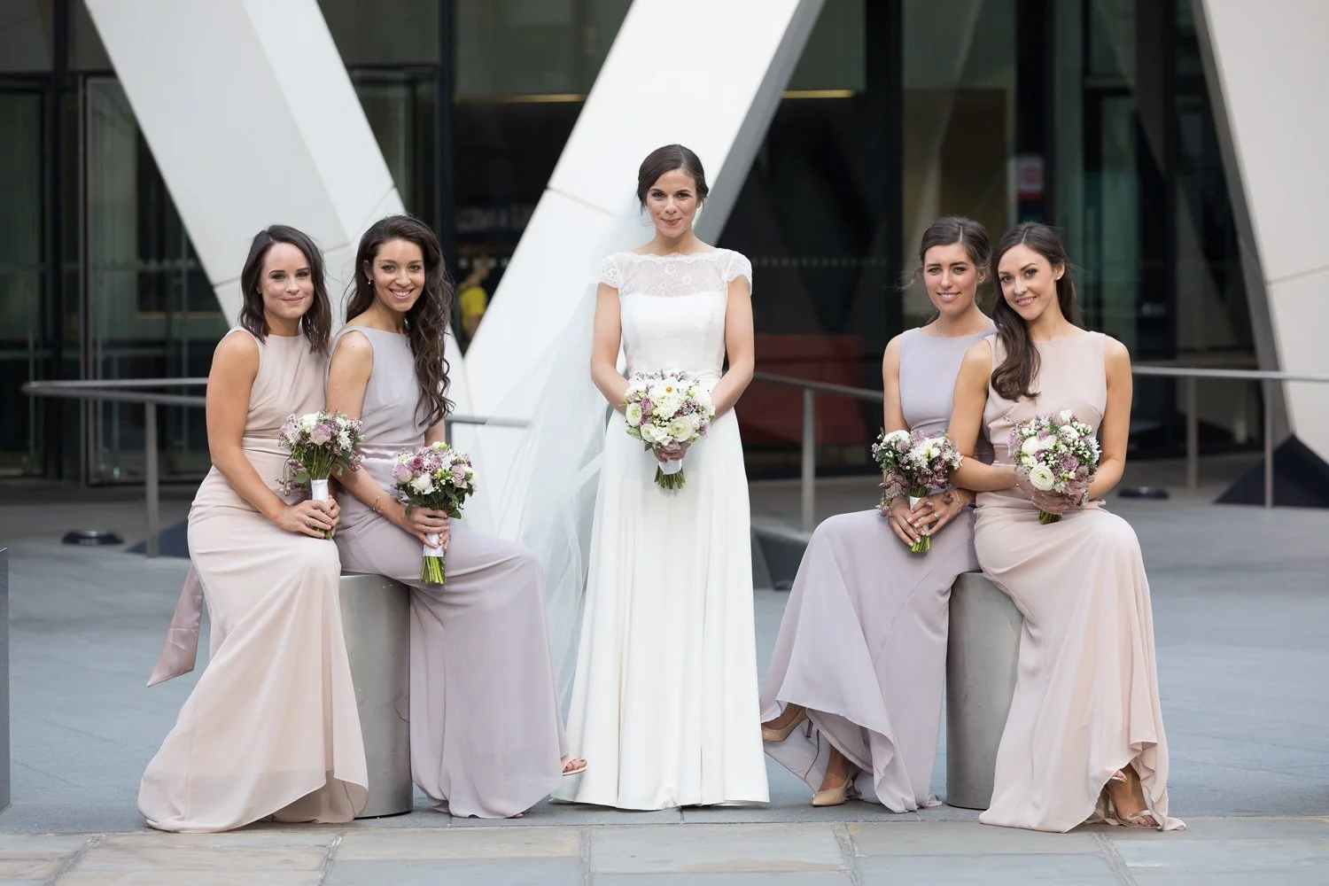 Wedding floristry in London and West Sussex, showcasing ceremony arrangements and table flowers designed to complement modern venues.