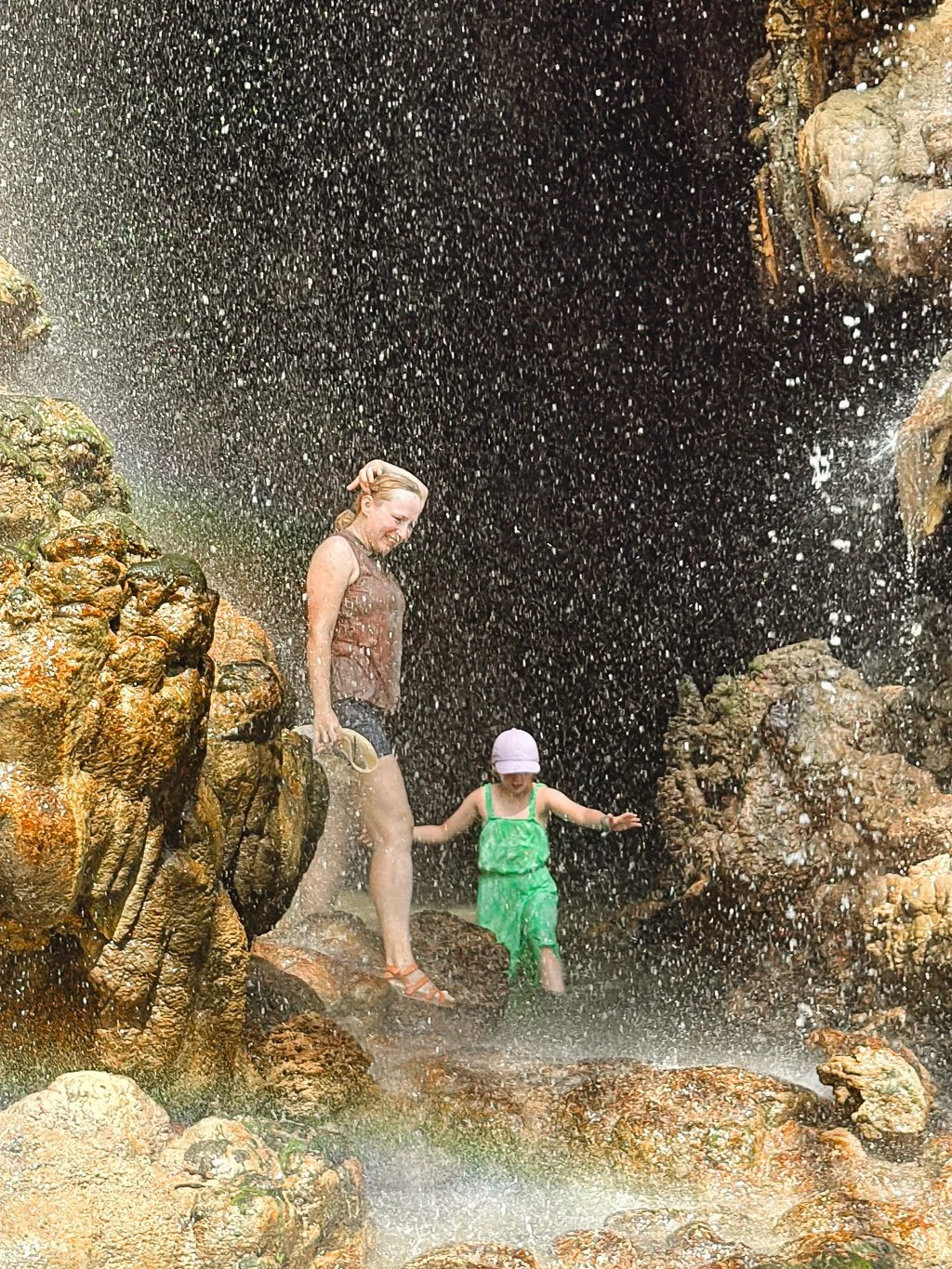   Entering one of the caves in the Tumpak Sewu Waterfalls complex  