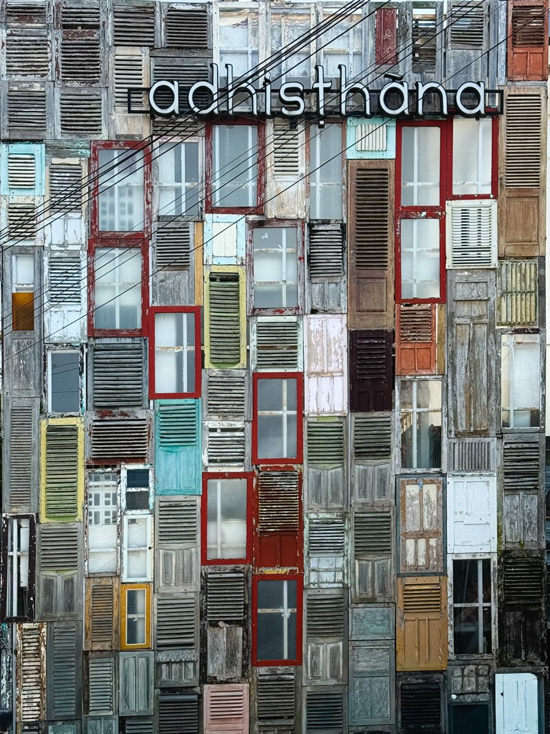   A unique facade made from… pieces of doors.  