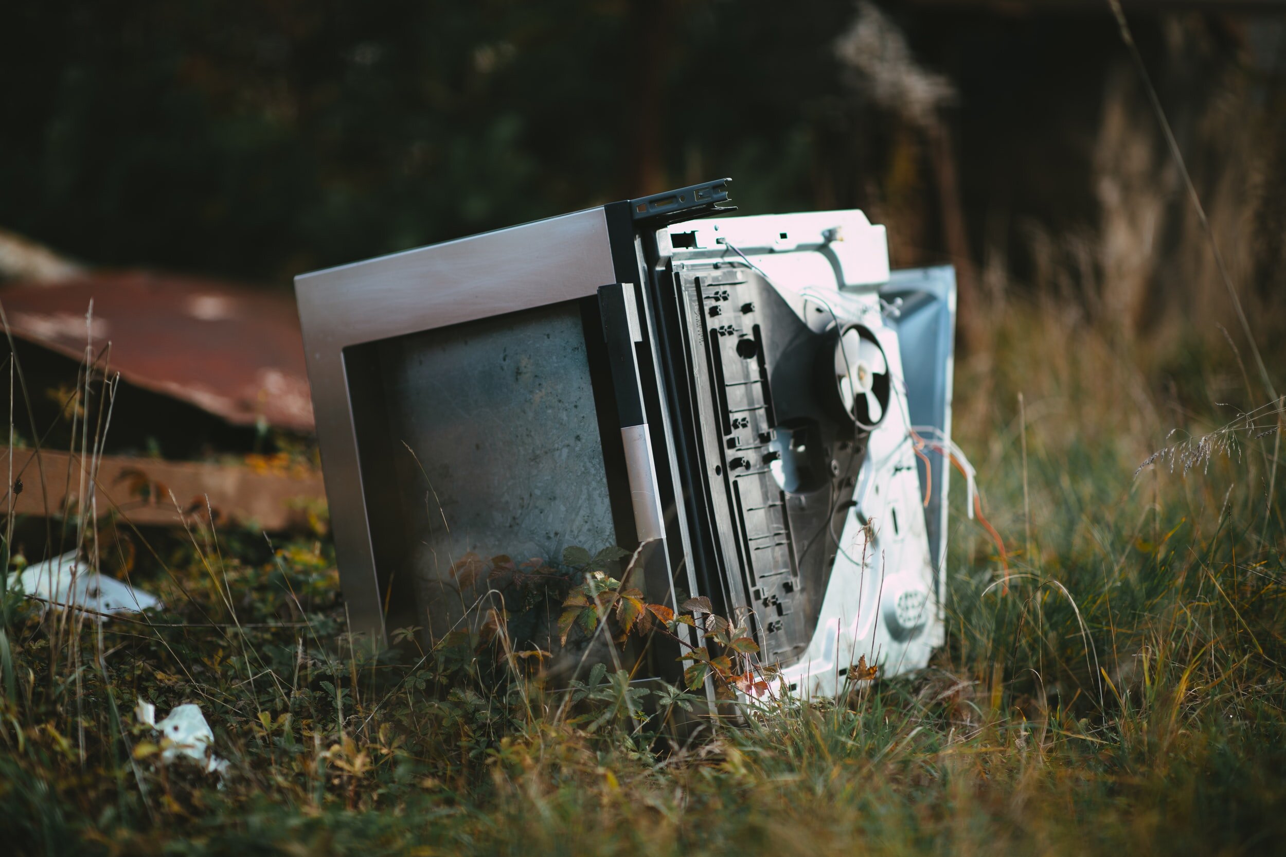 Broken electronics dumped in a field