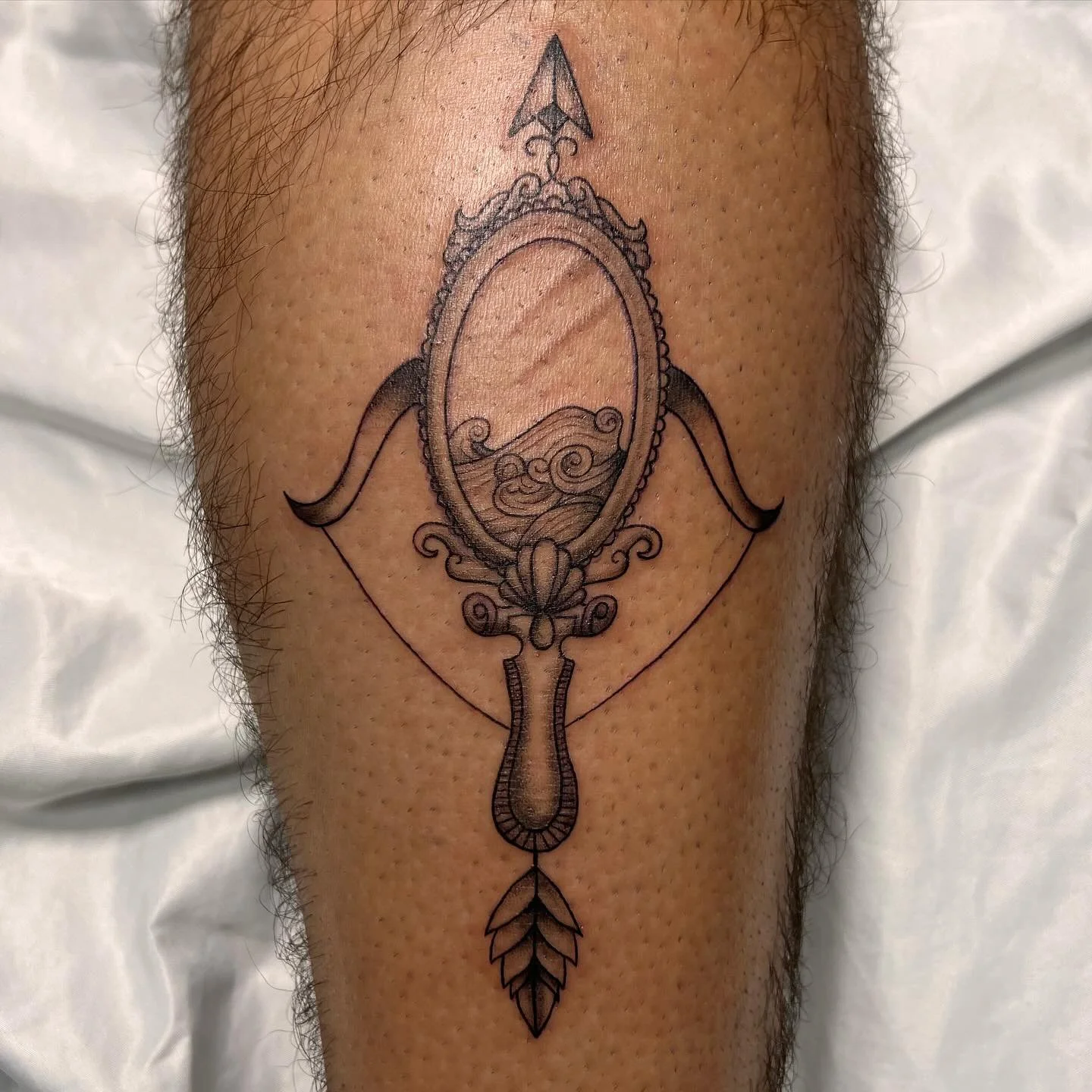 really enjoyed working on this piece🪞🌊🏹 #tattoo #blackandgreytattoo #mirror
