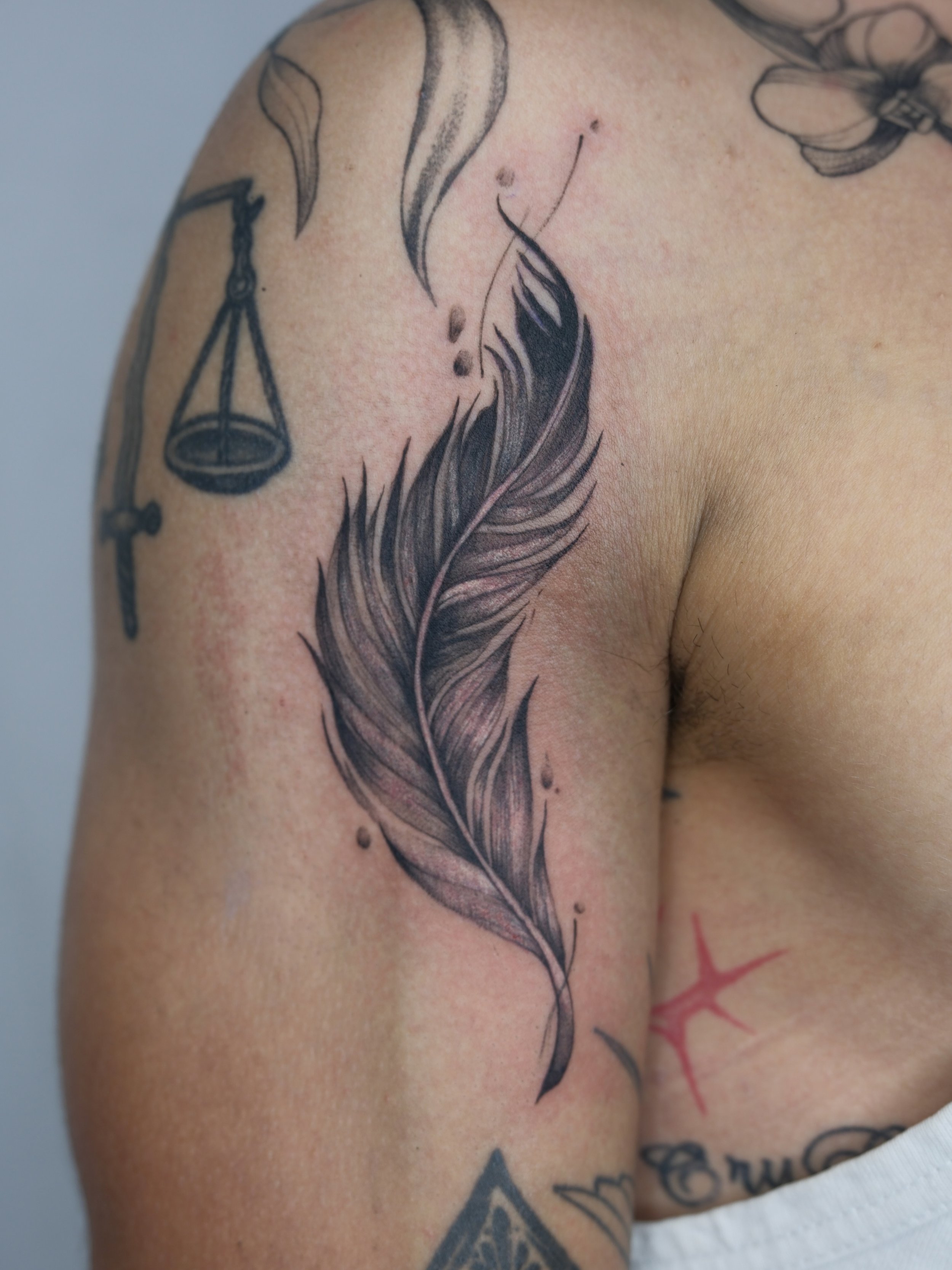 Custom realism feather designed to flow seamlessly with the arm&rsquo;s shape and existing tattoos For D. Thank you so much!
.
Now booking for July-Aug. Fill out my form link in bio to book.
.
#FinelinetattooartistMississauga
#WatercolortattooToronto