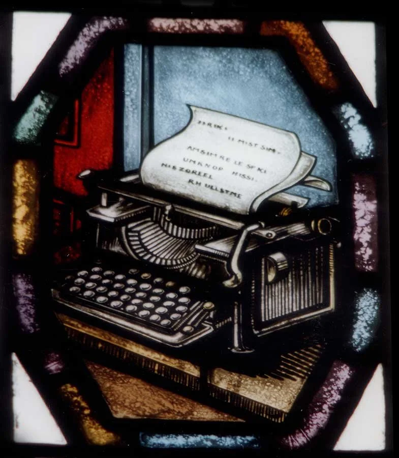 Stained glass window showing typewriter at Yale Law School