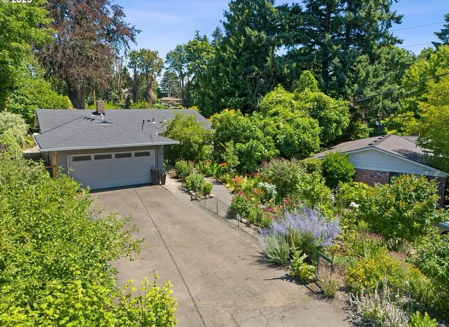 Tucked away on the end of a hidden dead-end street. The location is breathtaking! The oversized backyard looks out onto green space and is cultivated to perfection. Sitting high above the Springwater Corridor, which is not accessible from property, t