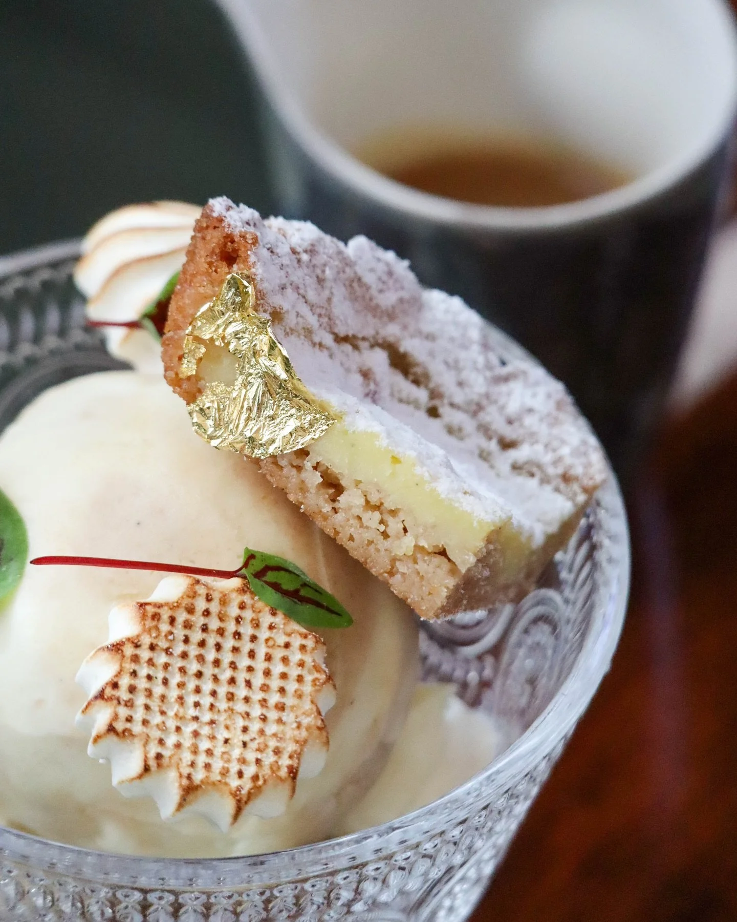 Gelato // butter cake, sweet cream cheese, miso butterscotch, toasted vanilla
&nbsp;
Cream cheese and brown sugar gelatos swirl together topped with warm miso butterscotch, toasted vanilla meringues, and a mini slice of Gooey Butter Cake in our curre