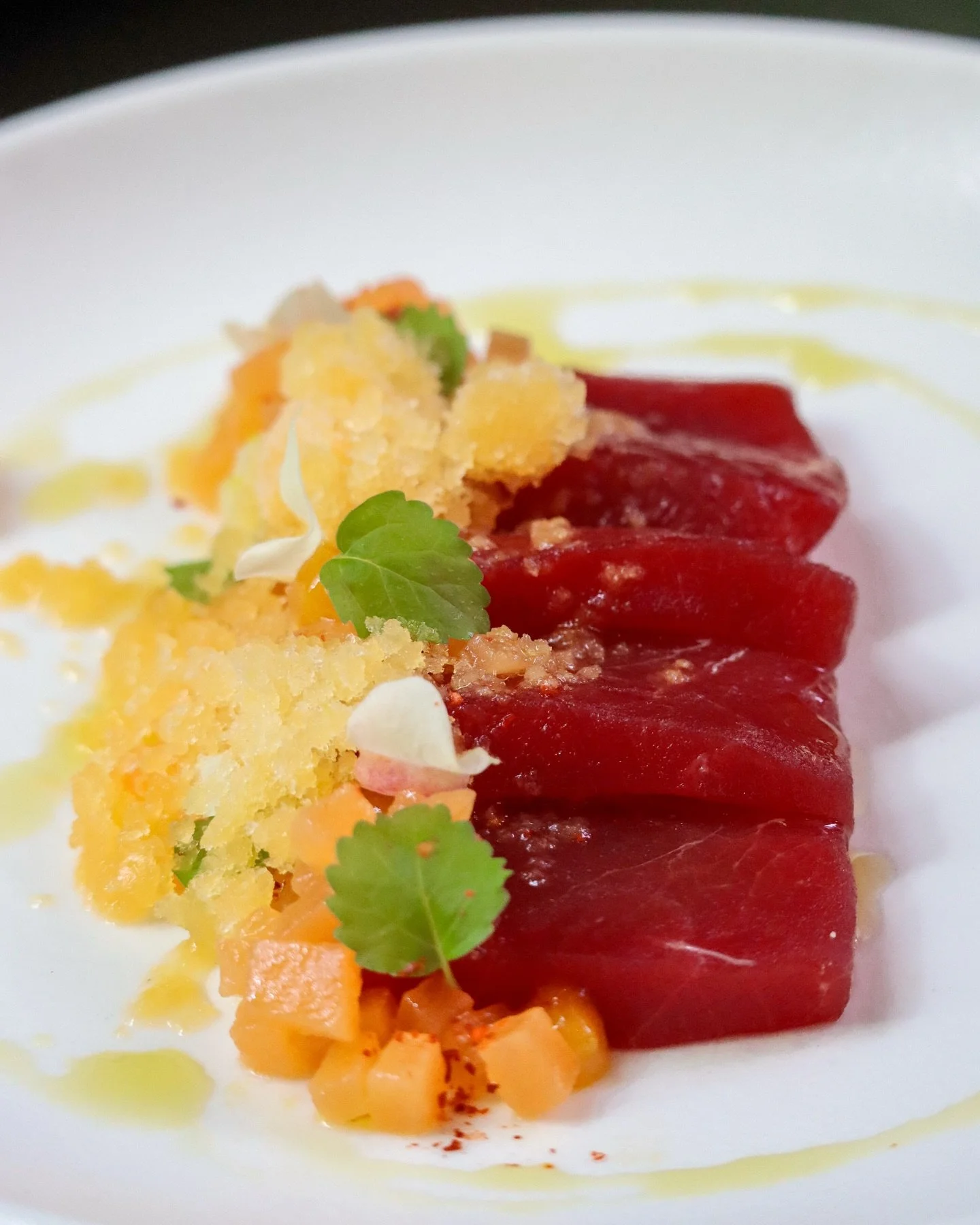 Tonno e Melone di Puglia evokes the essence of summer in Southern Italy.
&nbsp;
Bluefin tuna &mdash; fresh from Maine &mdash; rests beside compressed melon from Farmer Dave, kissed with limoncello granita and a touch of kumquat gel.
&nbsp;
Finished w