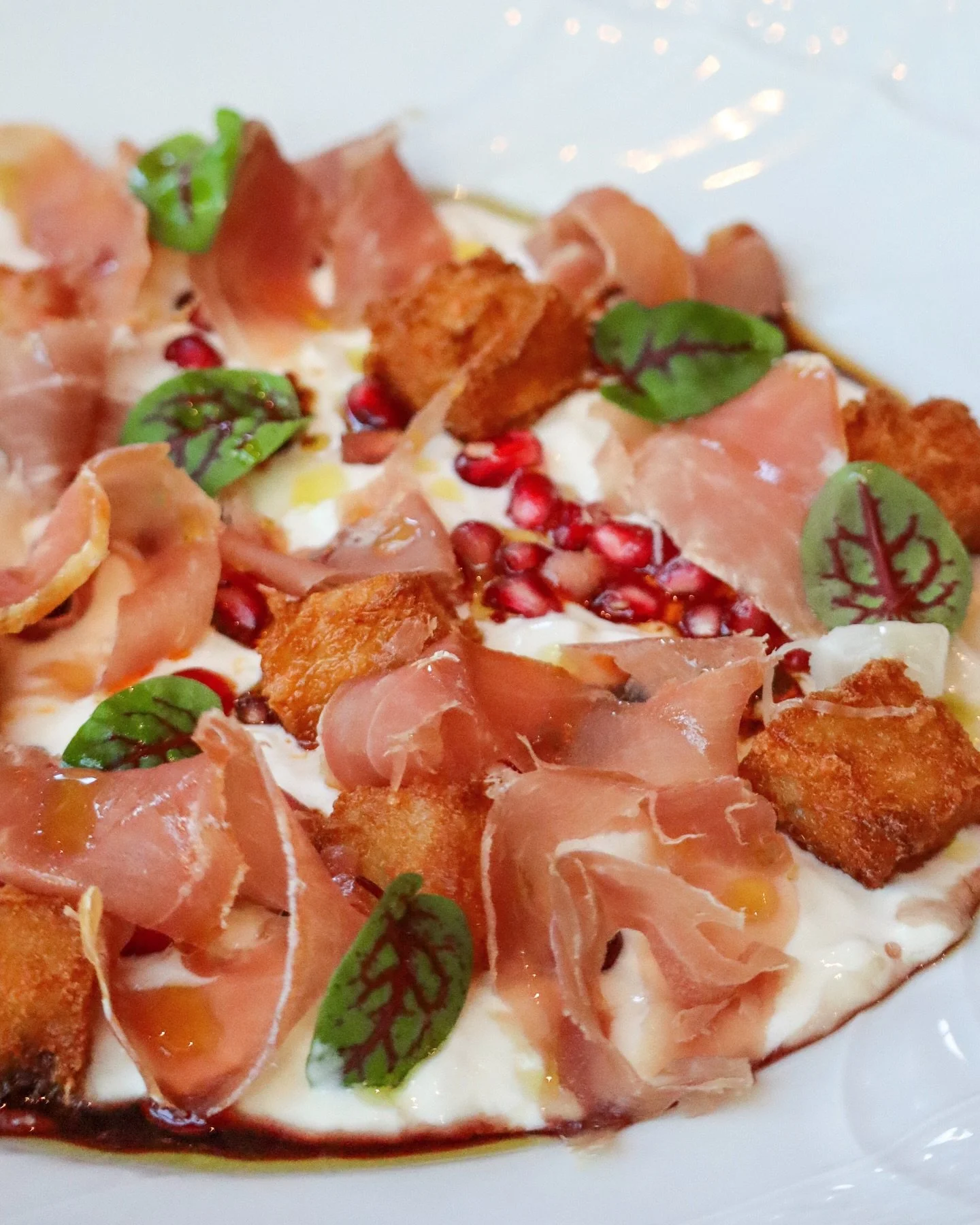 Aged in the breezes of the Adriatic and the shadows of the Dolomites, Prosciutto di San Daniele brings a delicate, silken richness to this season at Yolan.
&nbsp;
Paired with burrata and fluffy gnocco fritto or folded beside our Montasio-laced frico 