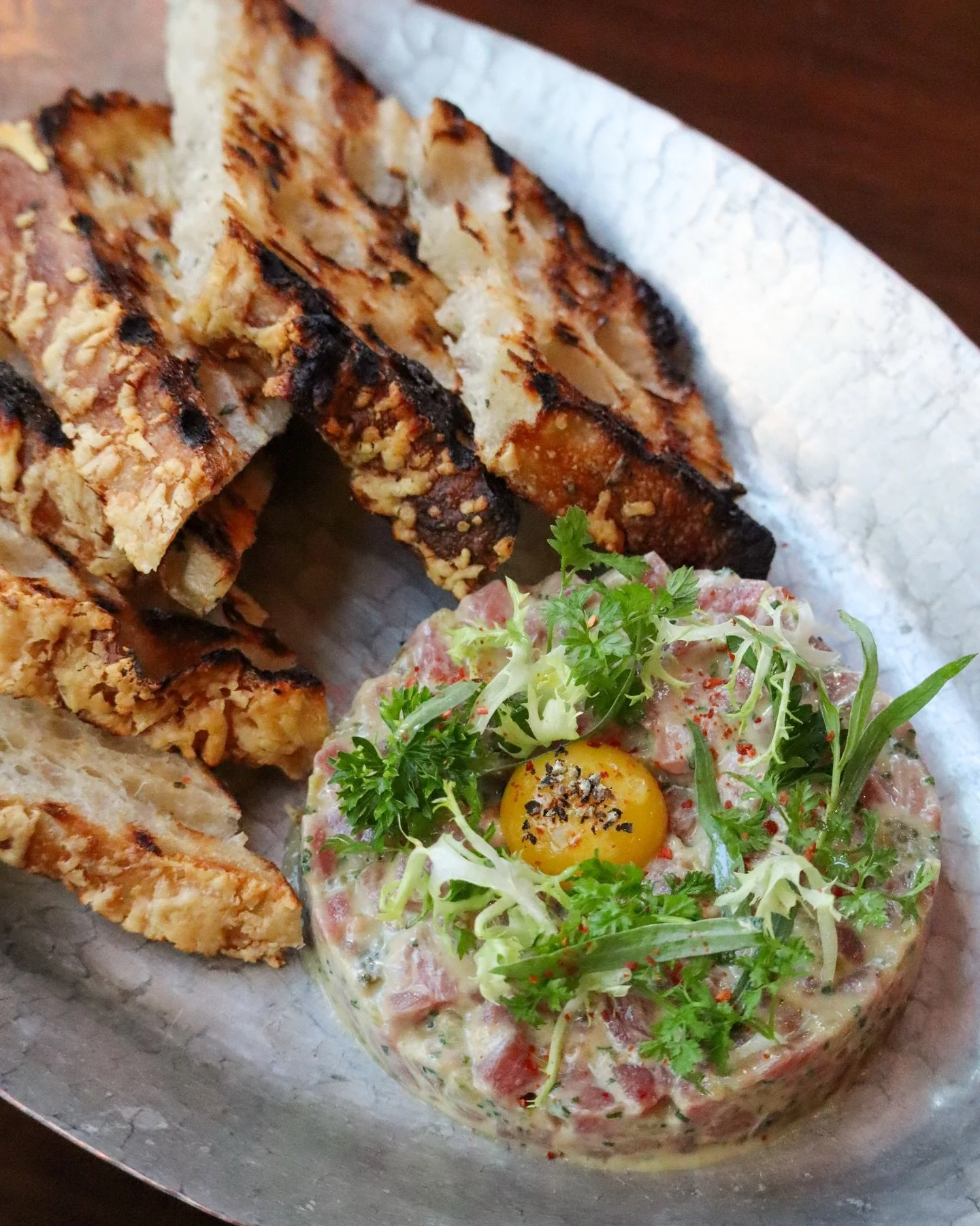 Carne Cruda all&rsquo;Albese // steak tartare, quail egg, mustard, cornichon, focaccia
&nbsp;
An enduring expression of Piemonte&rsquo;s reverence for pristine ingredients, Carne Cruda all&rsquo;Albese reflects the quiet confidence of the Langhe. In 
