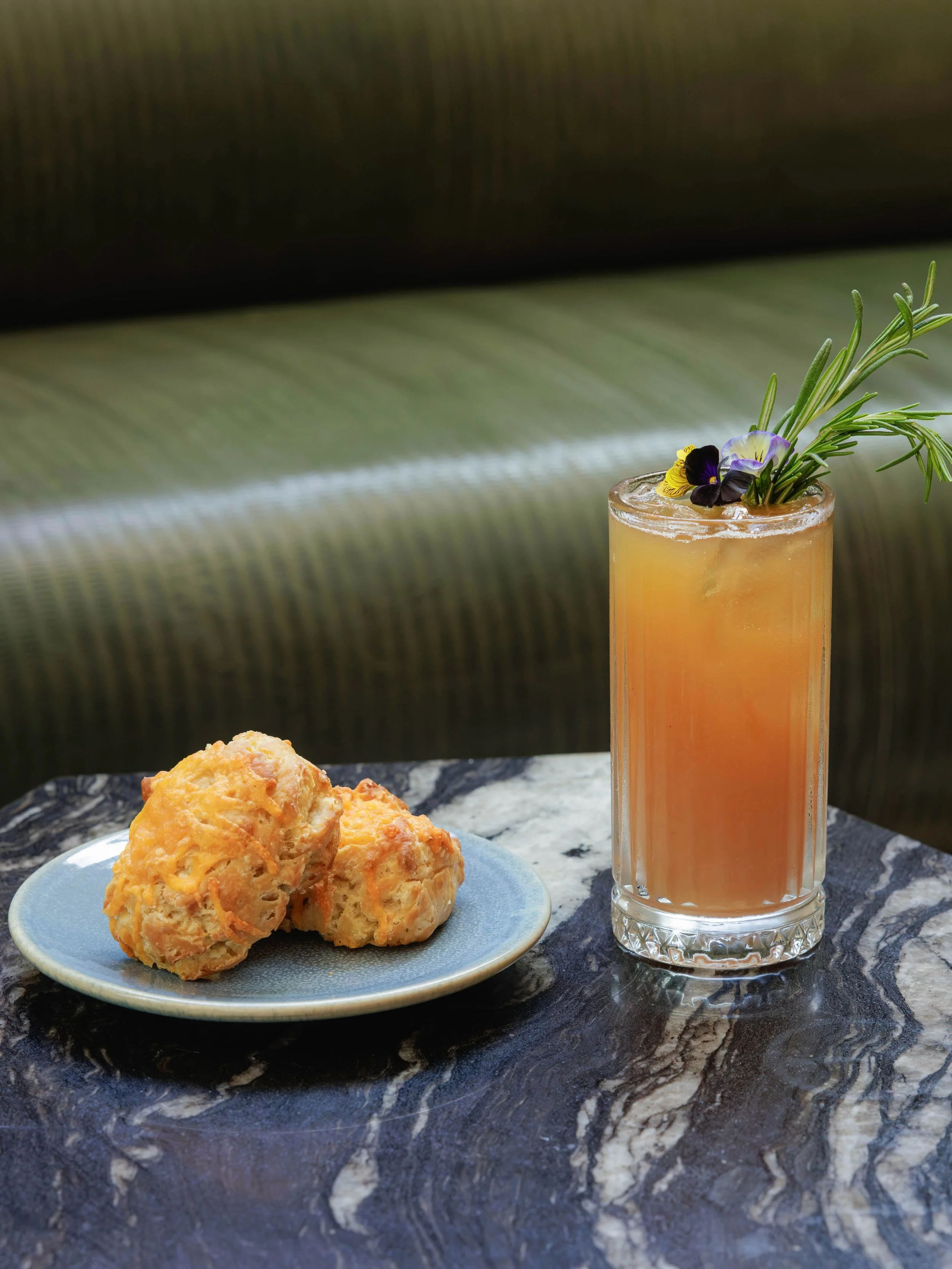 The South has long understood the comfort of biscuits and iced tea.

At Yolan, we honor that tradition with flaky cheddar biscuits and house-made peach rosemary iced tea, where Southern comfort is met with the seasonality and restraint of Italian coo