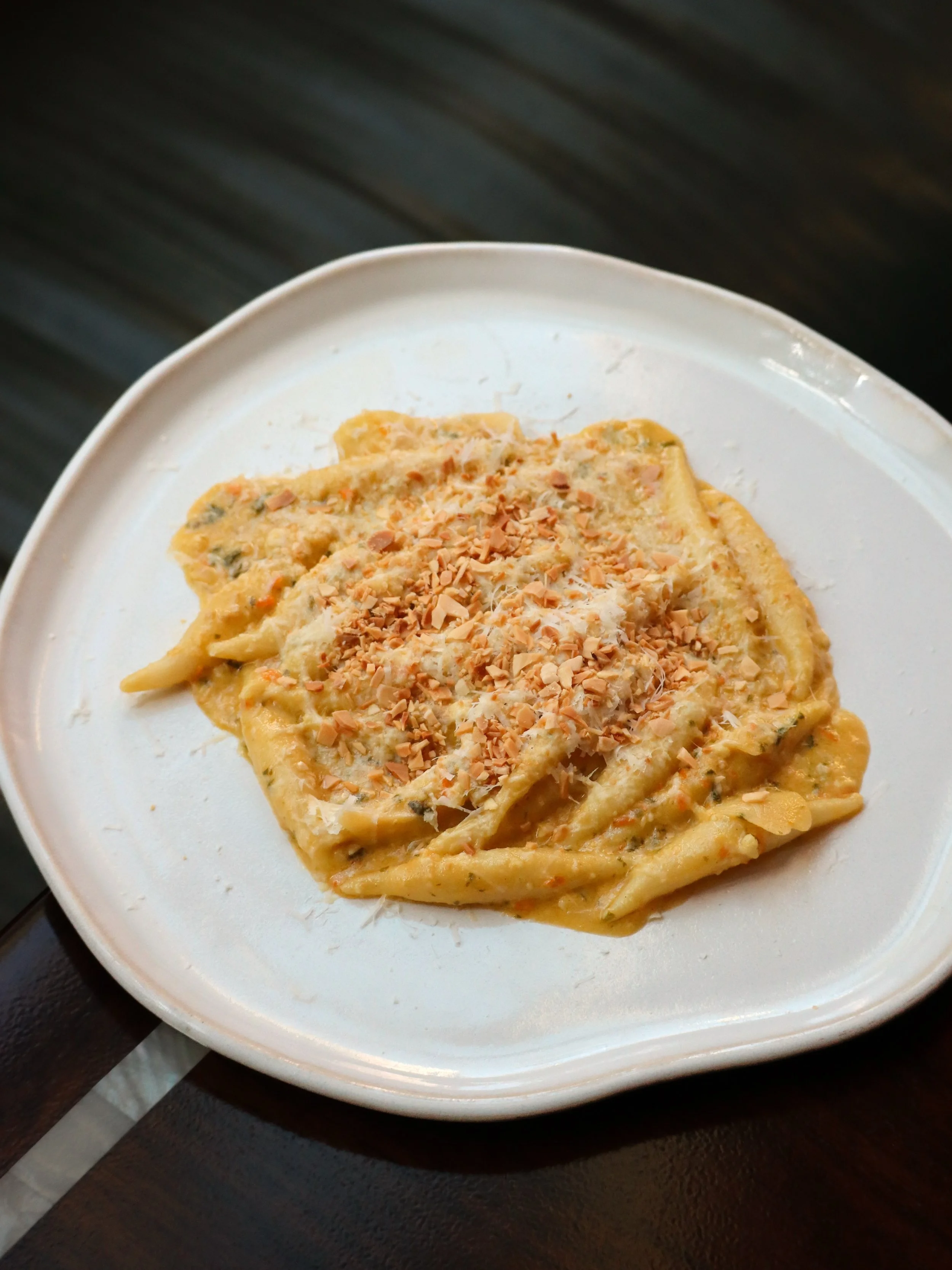 Yolan&rsquo;s hand-rolled gnocchi takes a new form with Sicilia.

Gnocchi alla Trapanese is coated in a vivid pesto of fresh tomato, toasted almond, basil, and Pecorino Siciliano, bringing the richness of the cheese and almond against the freshness o