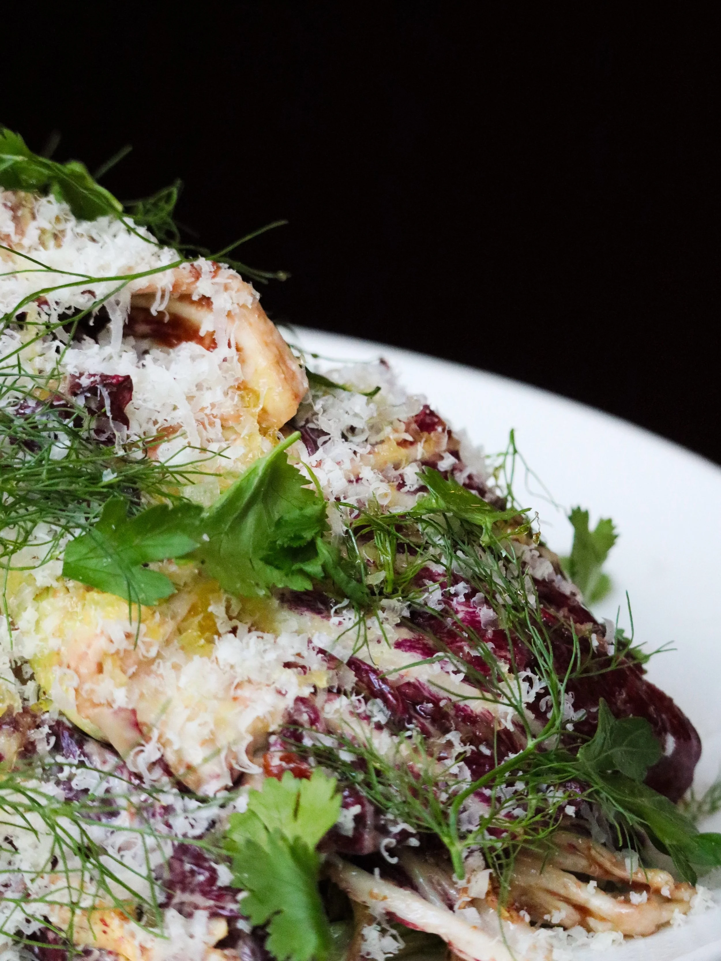 It&rsquo;s bright enough to refresh the palate, with enough character to hold its own alongside Sicilia&rsquo;s pastas and richer plates.

Bitter Greens is crisp radicchio coated in Caesar dressing, with tart cherry cutting through the richness of Pa