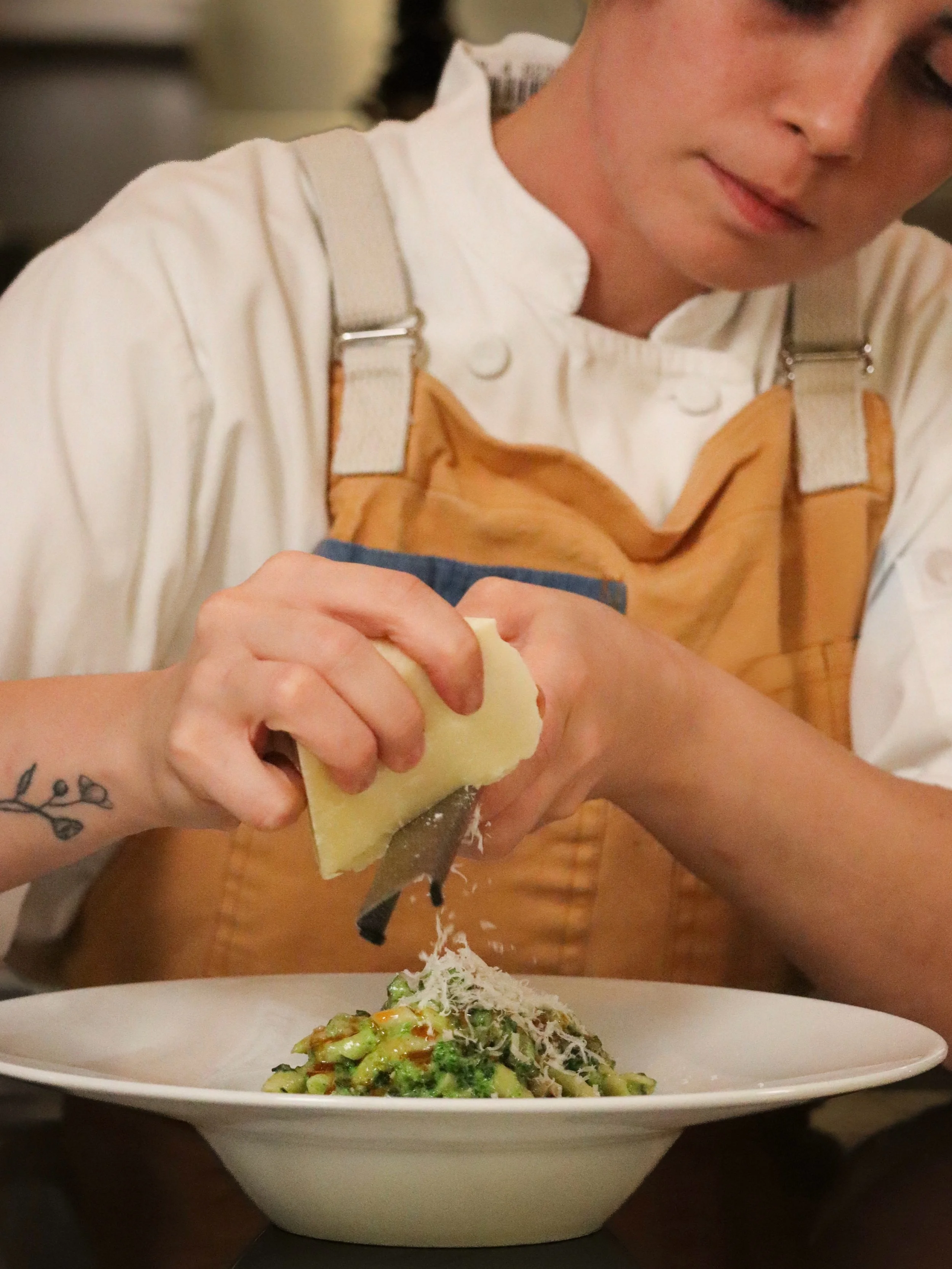 Busiate arrives with the savory richness of pork sausage and broccolini, finished with freshly grated Parmigiano Reggiano. Toasted pumpkin seeds add a roasted nuttiness, while chili oil leaves a warm, persistent finish.

A warm expression of Sicilia 