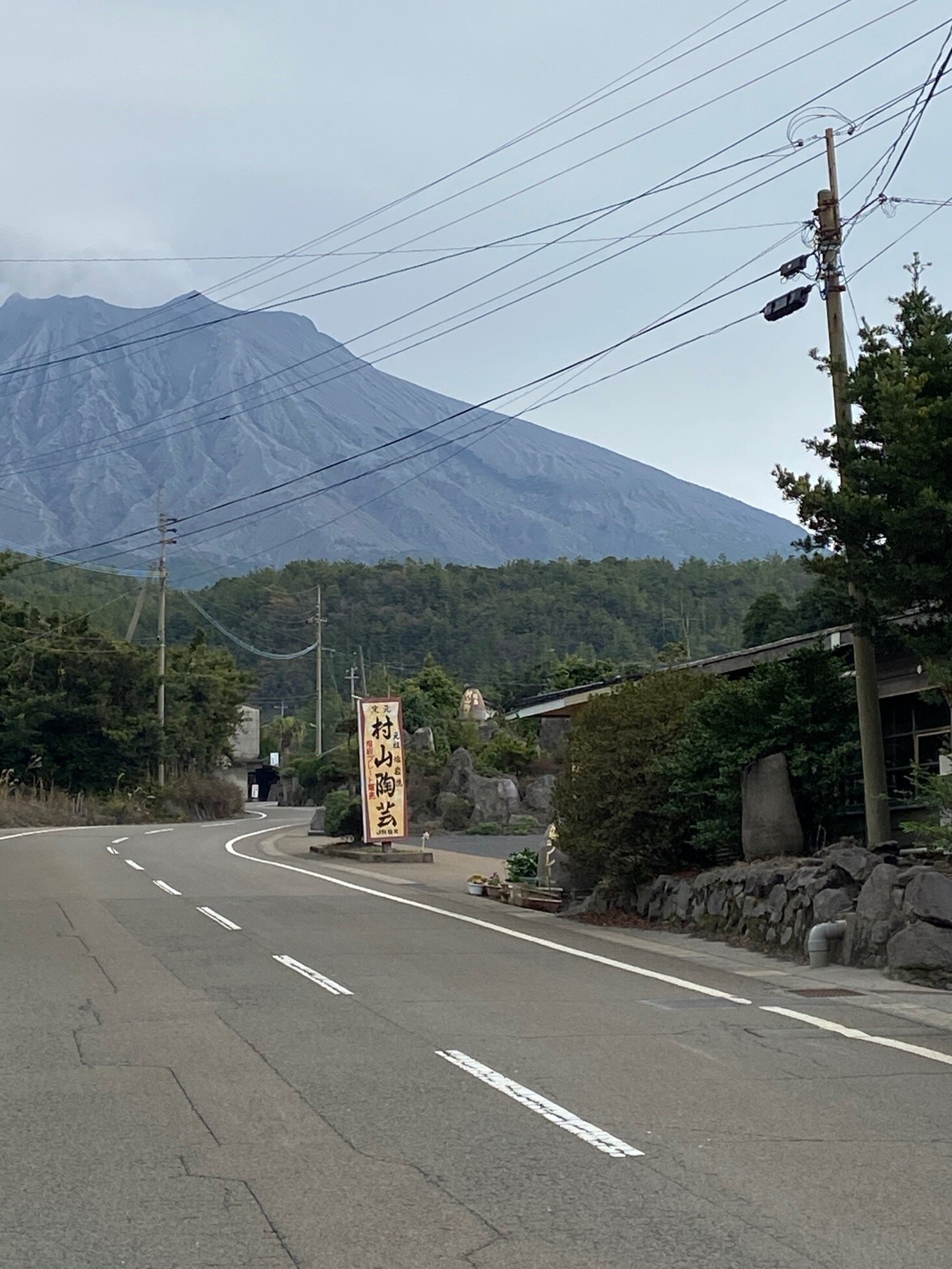 on street looking at pottery and Sakurajima.jpg