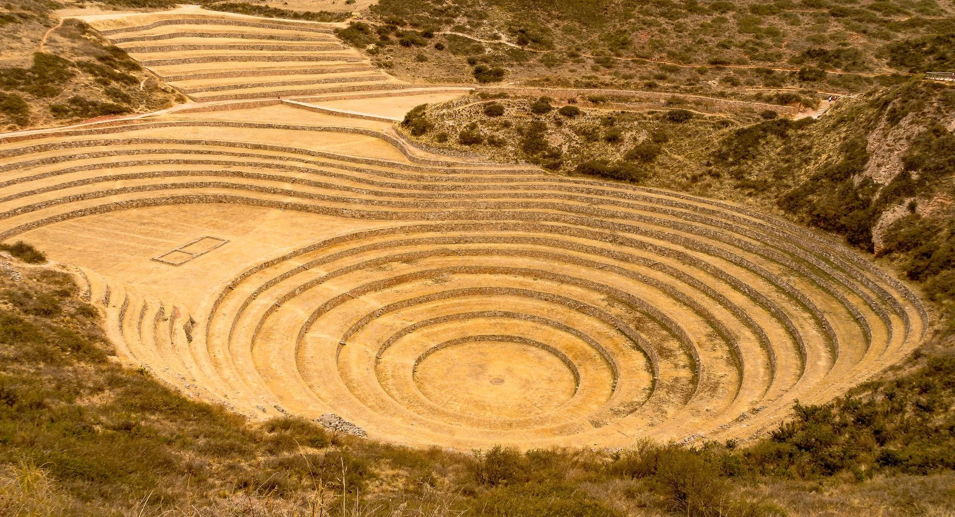   Tipón — An archaeological complex of Inca-era terraces, irrigation canals, and finely dressed stonework located east of Cusco in the Sacred Valley, famed for its still-working hydraulic system and scenic agricultural terraces.  